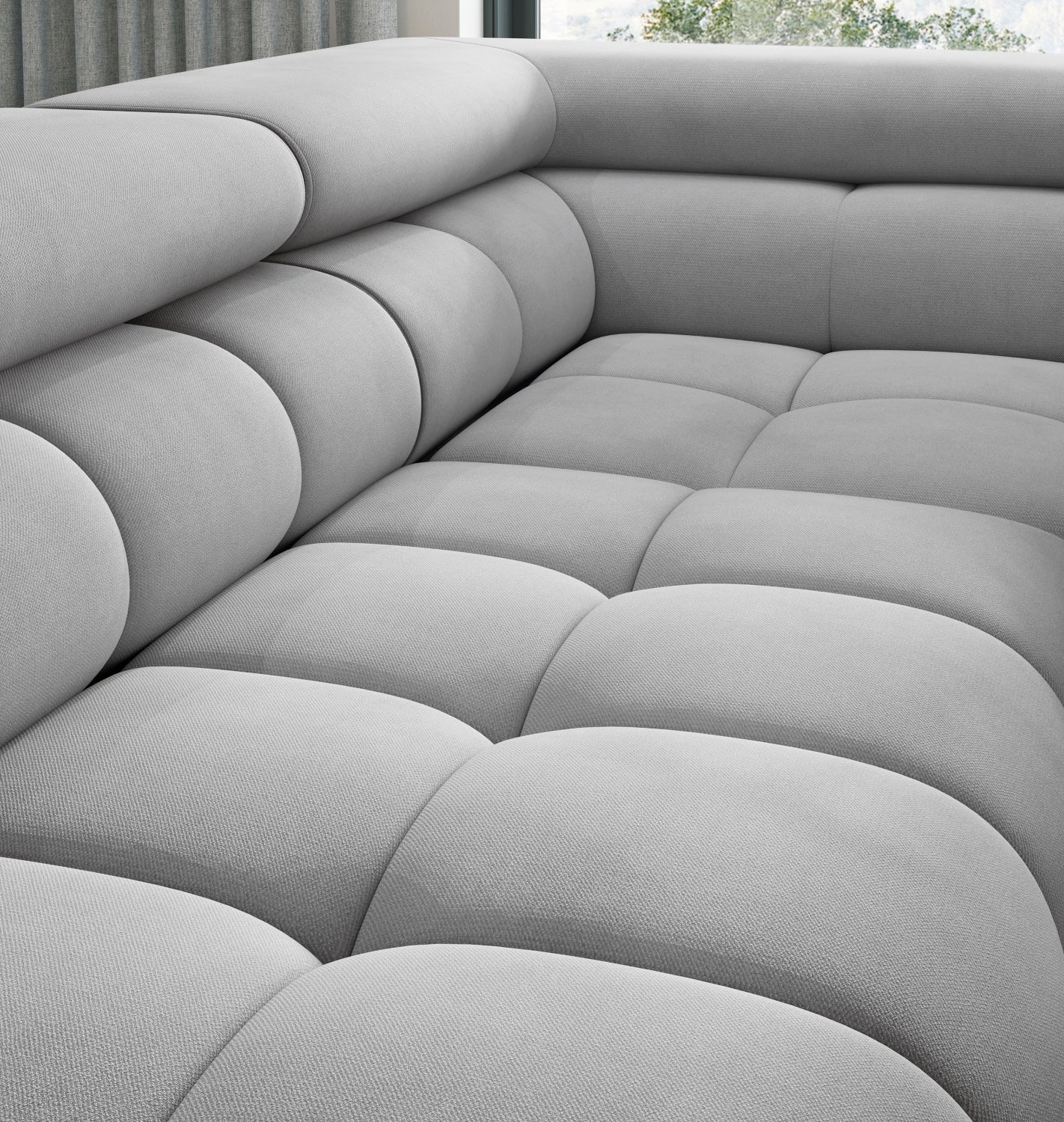 Pikowane siedzisko narożnika Ferucce w układzie prawym, wykończone tkaniną Paros 05.