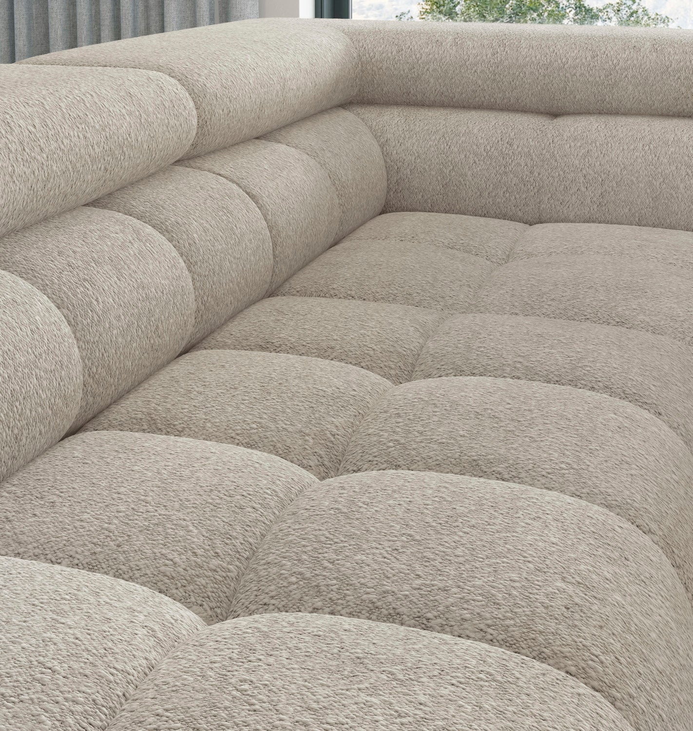 Zbliżenie na miękkie siedzisko z zaokrąglonymi pikowaniami, ukazujące fakturę materiału.