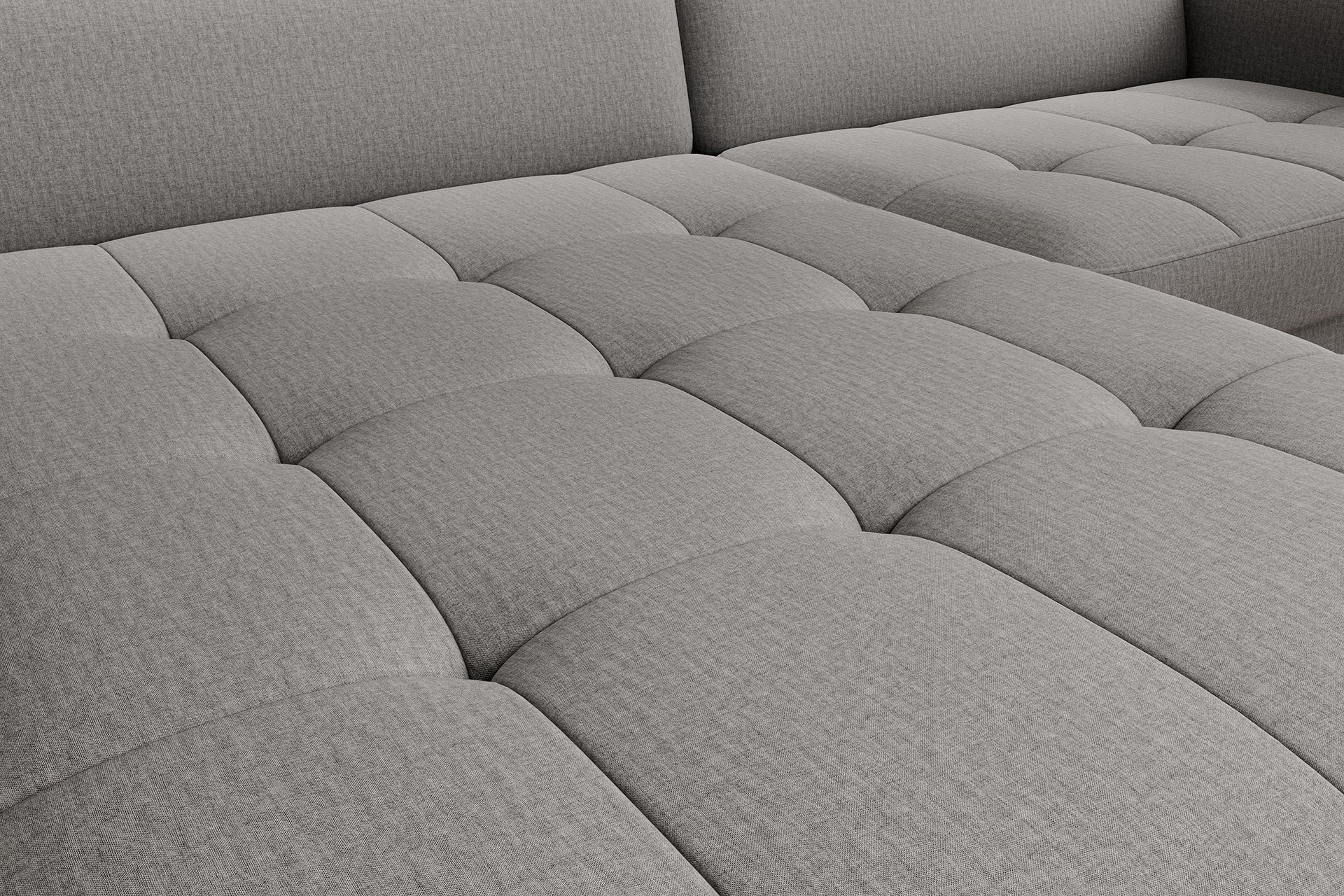 Zbliżenie na pikowane przeszycia siedziska narożnika Gomsi Manhattan 03 jasnoszary w układzie lewym, tworzące regularny wzór kwadratów.