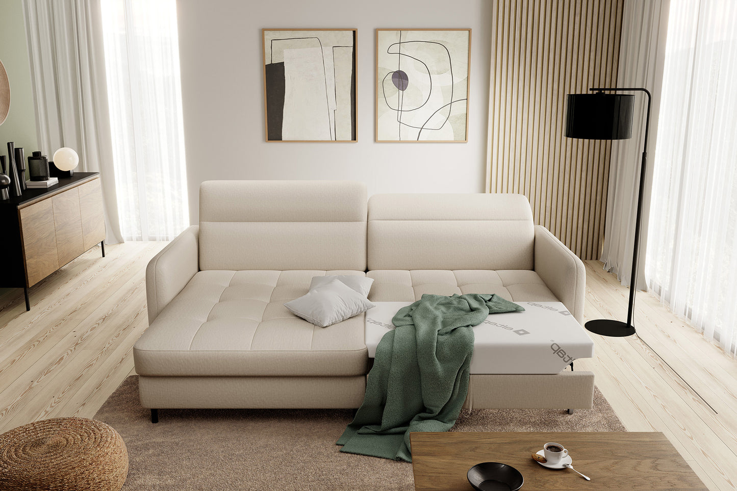 Narożnik Gomsi Manhattan 18 jasnobeżowy rozłożony do spania – wysunięty materac z poduszką i zielonym kocem, pokazujący funkcję spania.