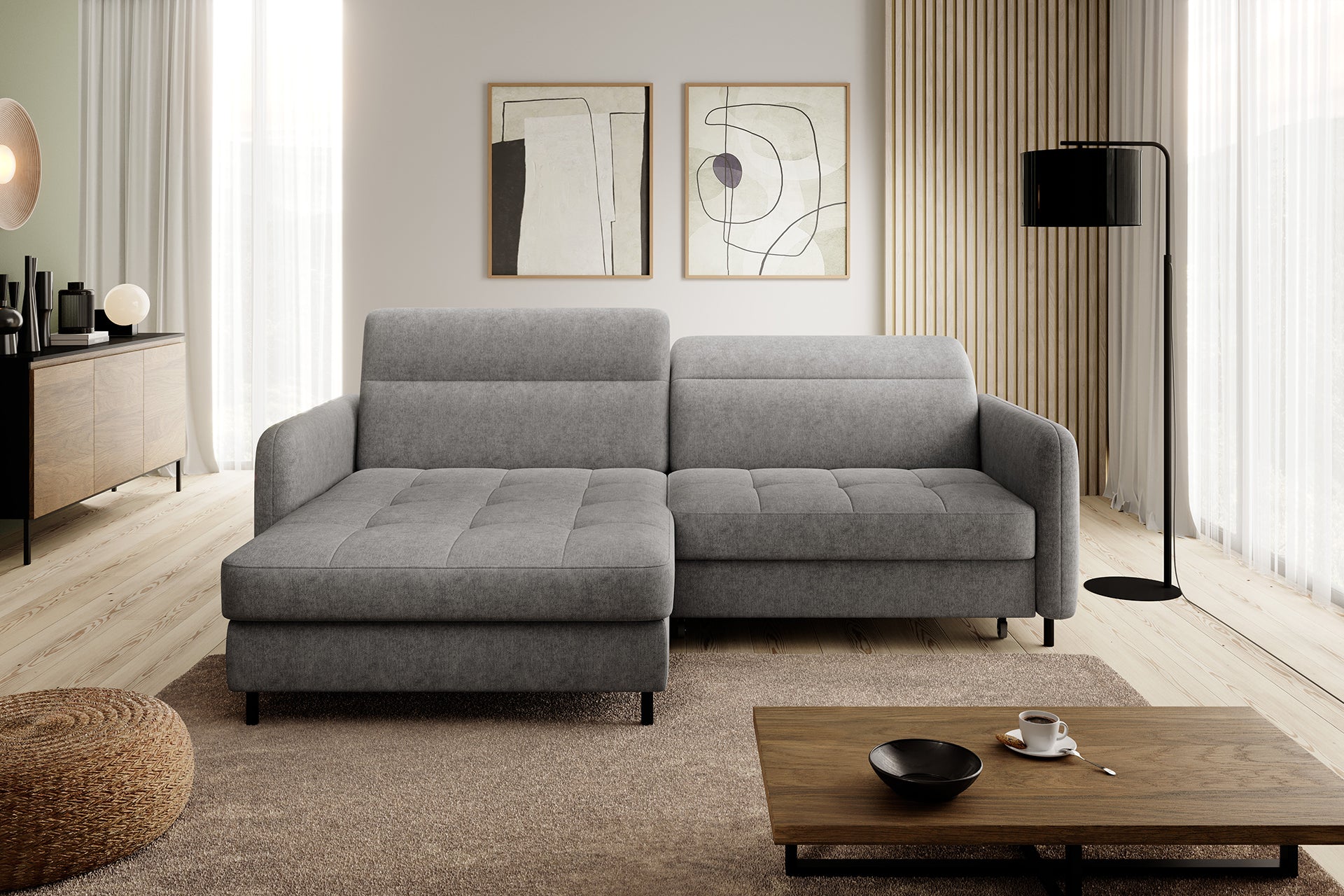 Narożnik Gomsi Raquel 04 szary w układzie lewym w nowoczesnym salonie obok komody, stolika kawowego i lampy stojącej.