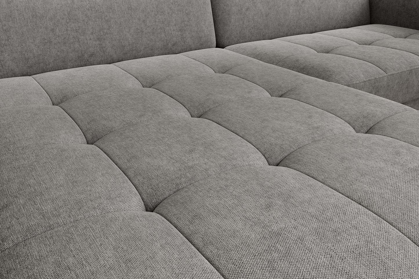 Detal pikowanego siedziska narożnika Gomsi Raquel 04 szary w układzie lewym – widoczne przeszycia i struktura tkaniny.