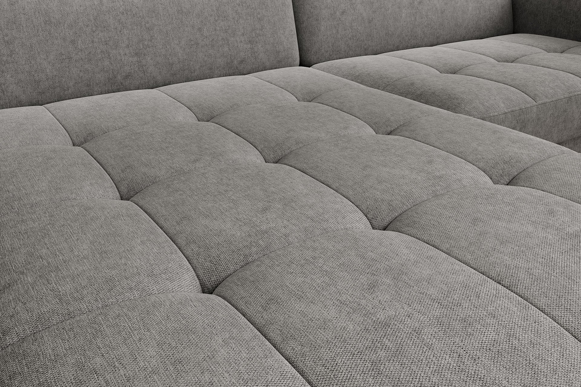 Detal pikowanego siedziska narożnika Gomsi Raquel 04 szary w układzie lewym – widoczne przeszycia i struktura tkaniny.