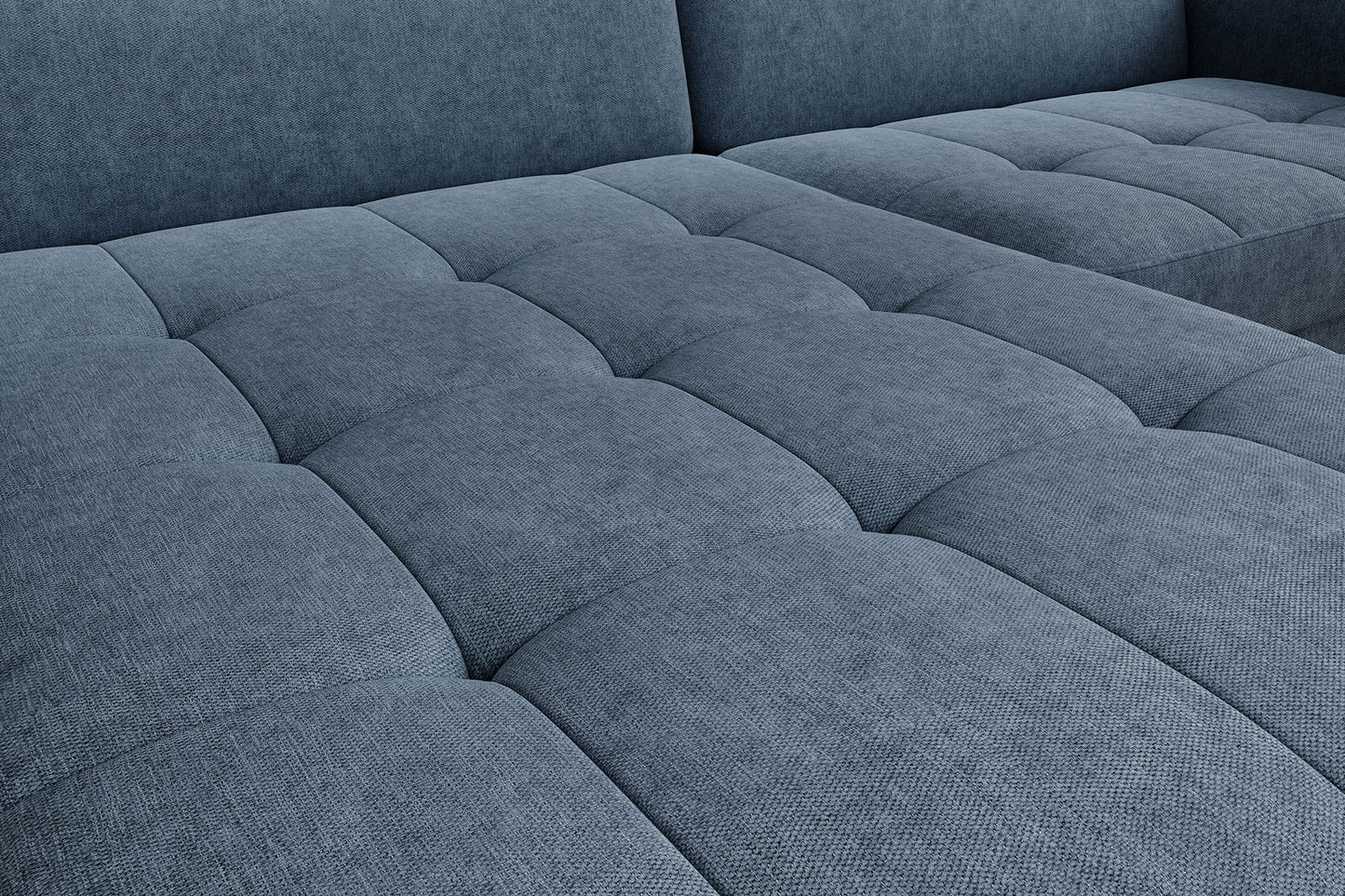 Detal pikowanego siedziska narożnika Gomsi Raquel 40 niebieski – widoczne przeszycia i tekstura tkaniny.