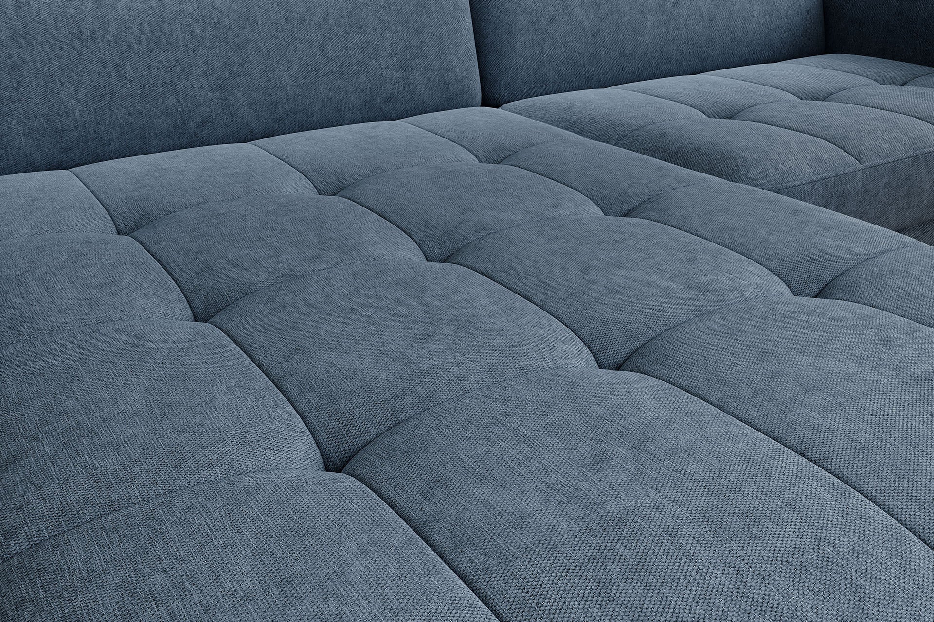 Detal pikowanego siedziska narożnika Gomsi Raquel 40 niebieski – widoczne przeszycia i tekstura tkaniny.