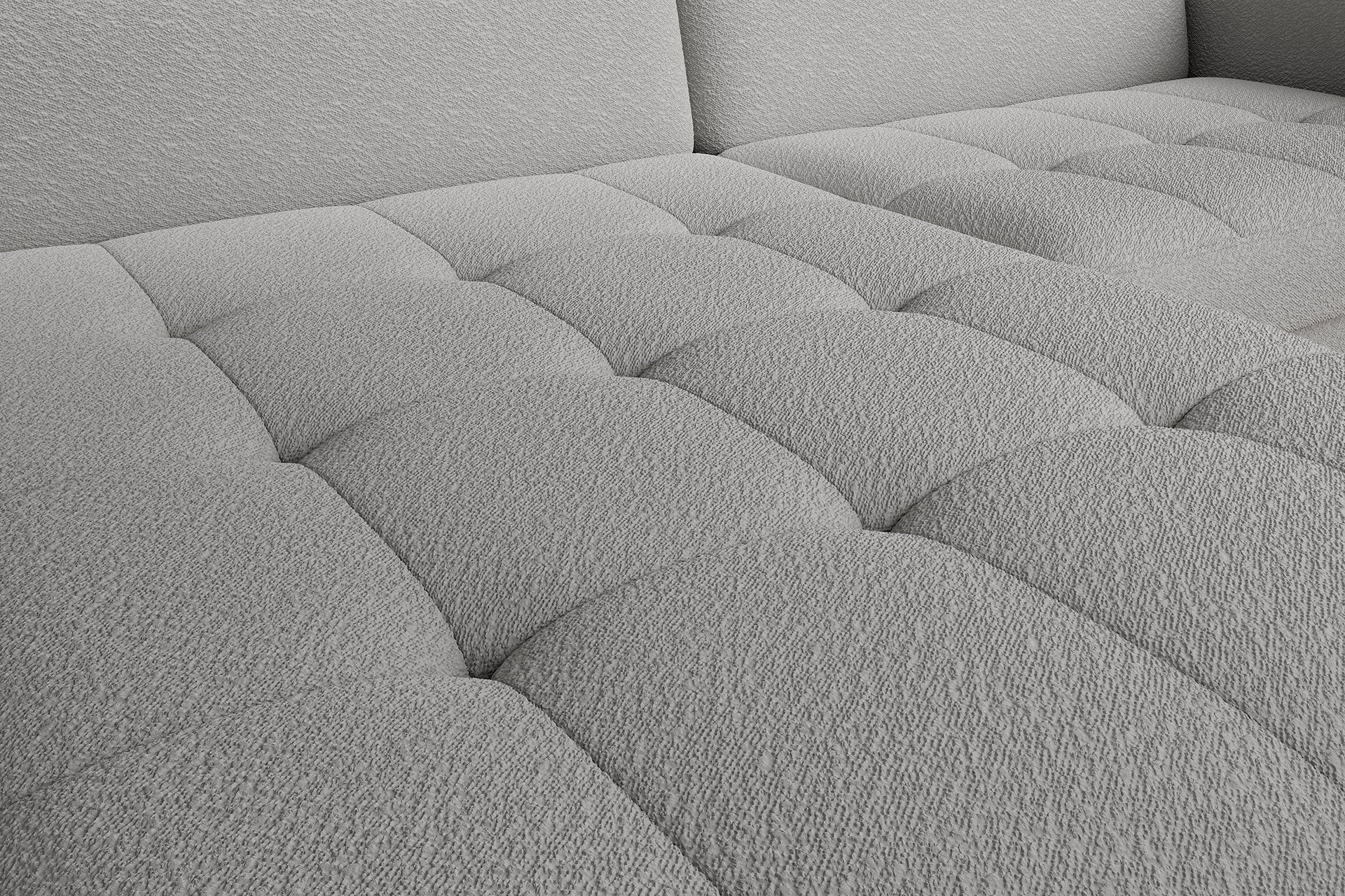 Zbliżenie pikowanego siedziska narożnika Gomsi Royal 04 szary – wyraźna faktura tkaniny i staranne przeszycia.