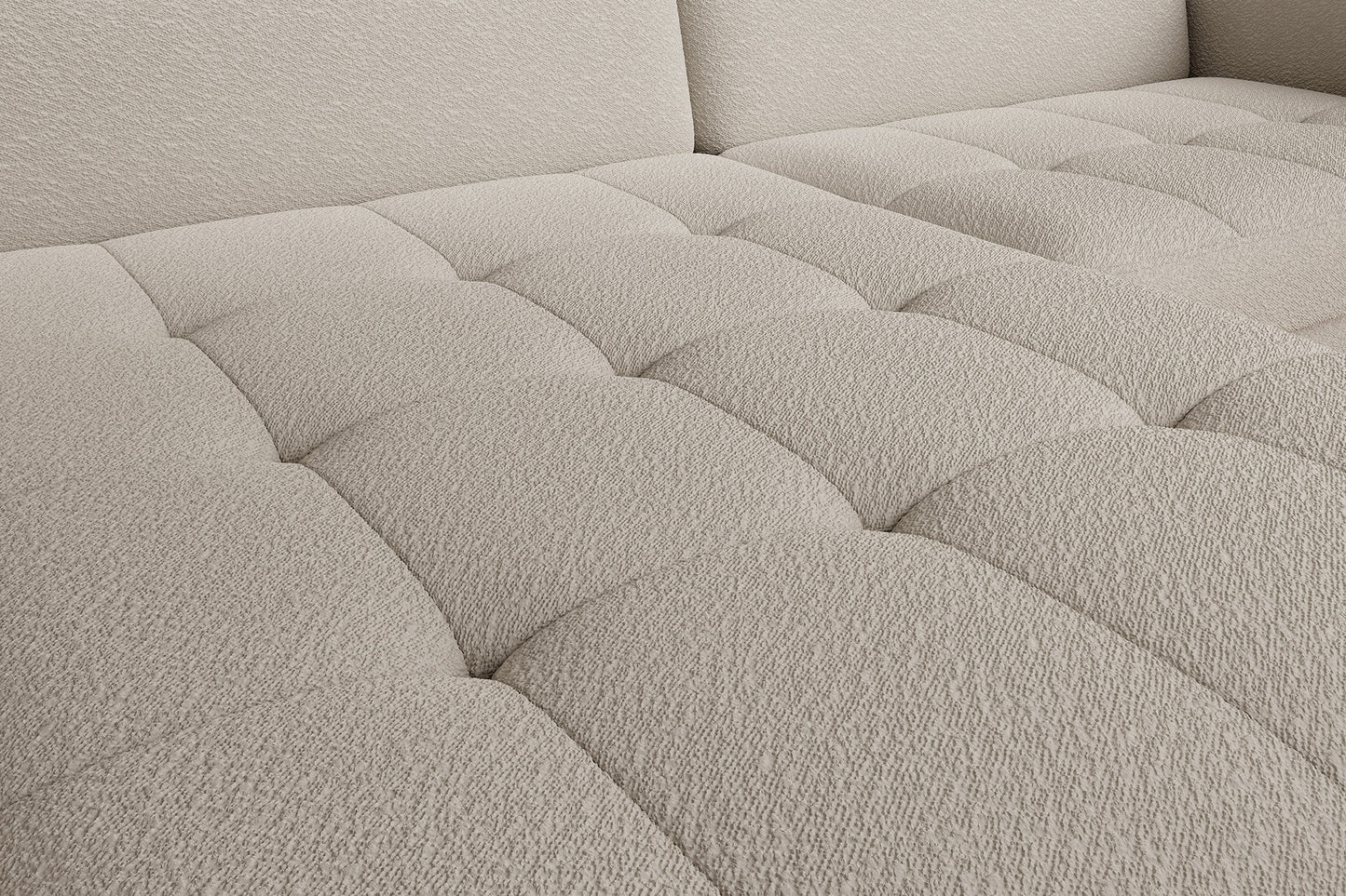 Zbliżenie na pikowane siedzisko narożnika Gomsi Royal 18 beżowego, struktura i faktura tkaniny boucle.