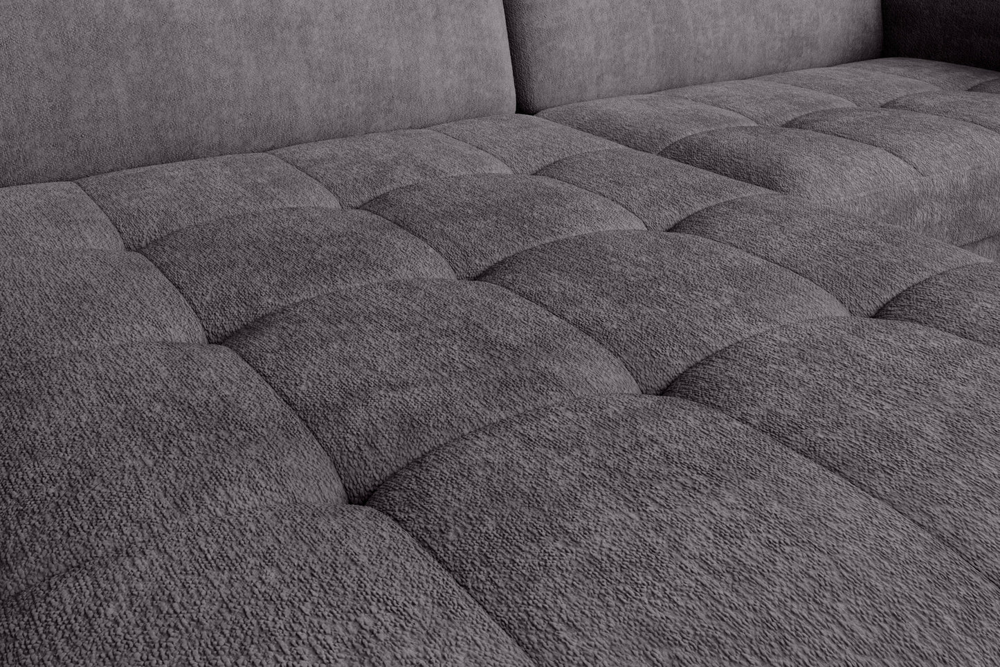 Narożnik Gomsi Touch 05 szary w układzie lewym – zbliżenie na fakturę pikowanego siedziska podświetlone naturalnym światłem.