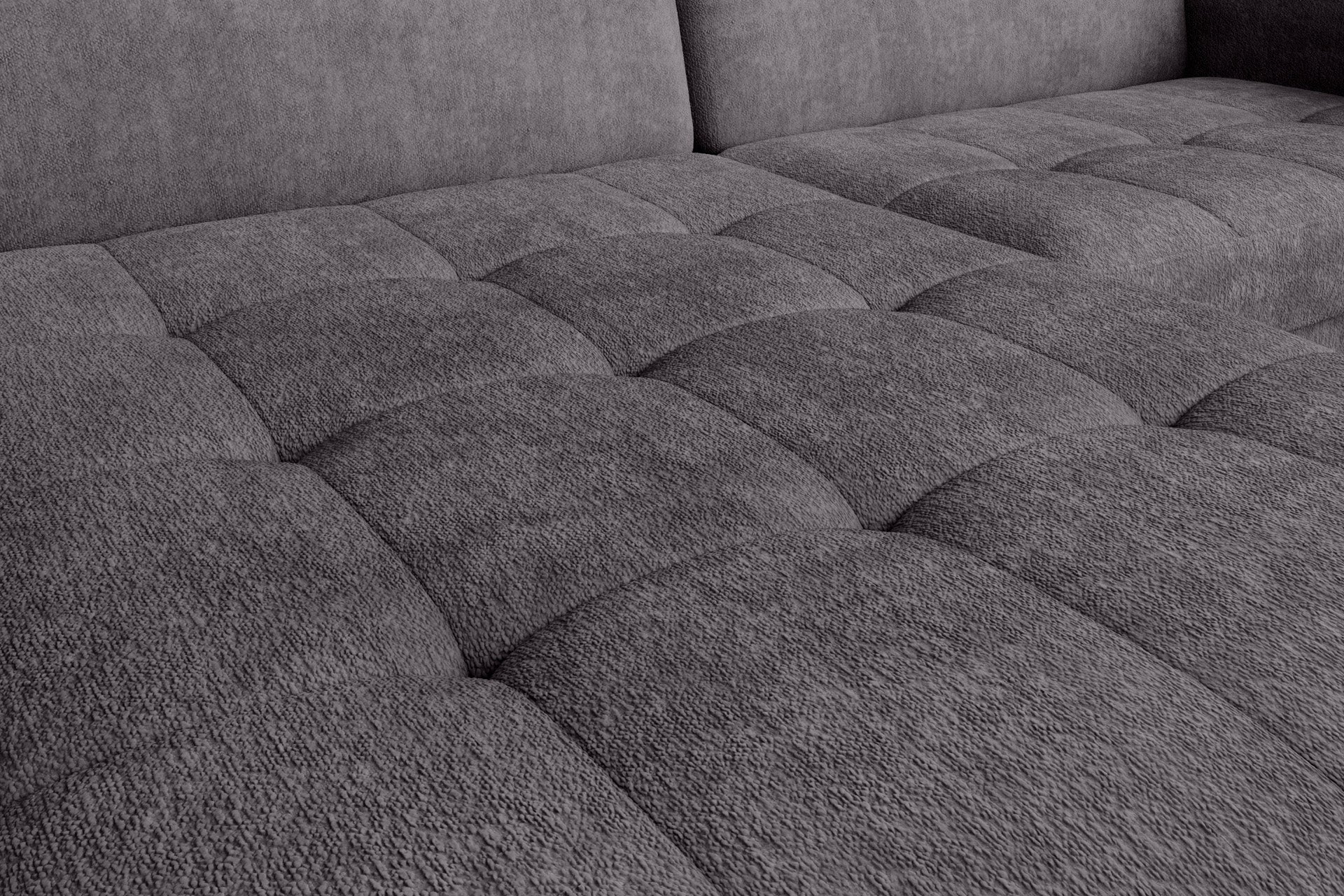 Narożnik Gomsi Touch 05 szary w układzie lewym – zbliżenie na fakturę pikowanego siedziska podświetlone naturalnym światłem.