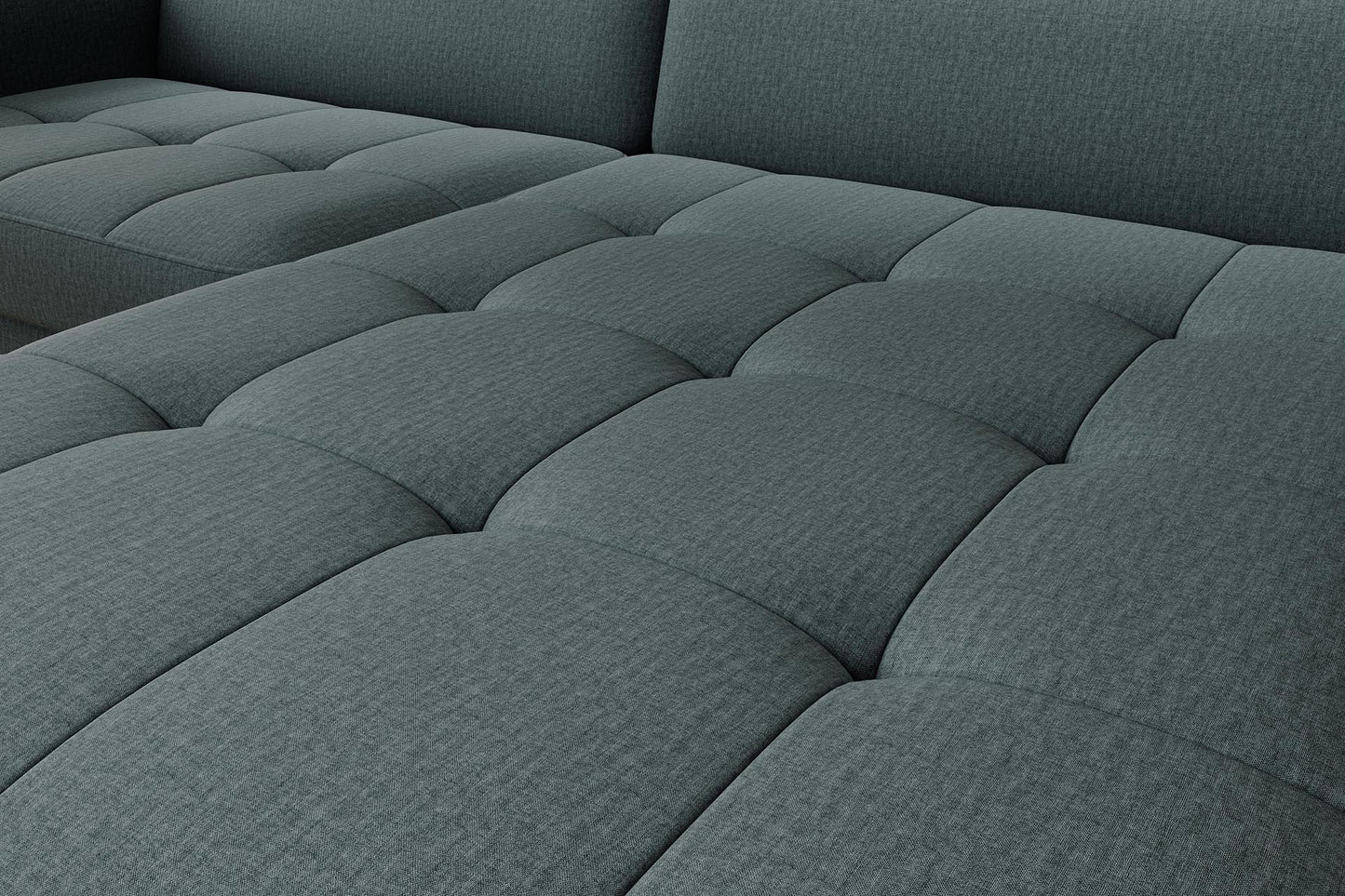 Zbliżenie na pikowane siedzisko narożnika Gomsi Manhattan 38 zielonego, detal struktury tkaniny.