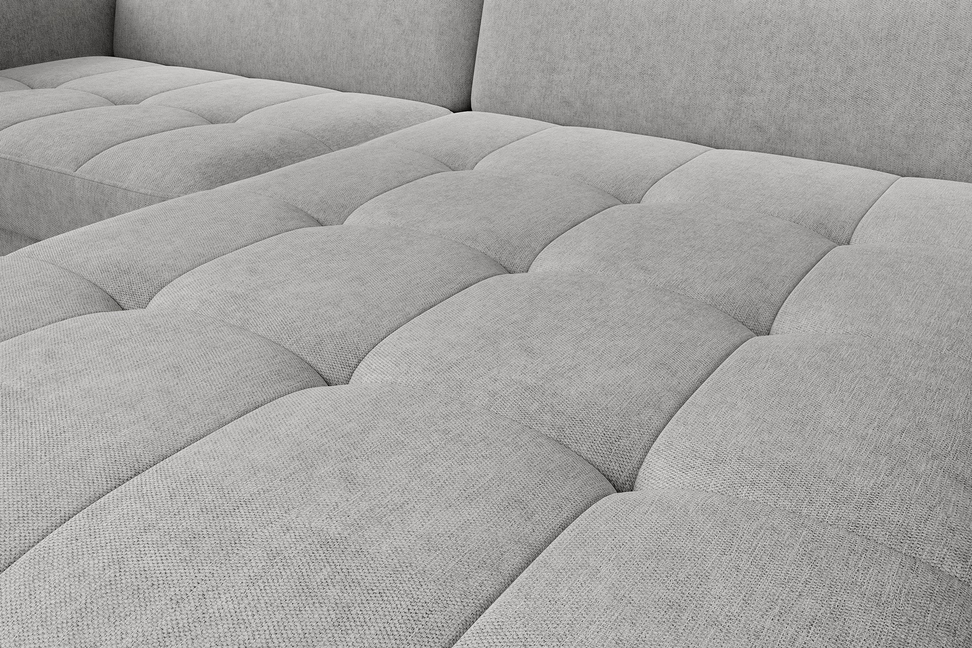 Zbliżenie na pikowane siedzisko narożnika Gomsi Raquel 03 jasnoszary, wyraźna struktura tkaniny.