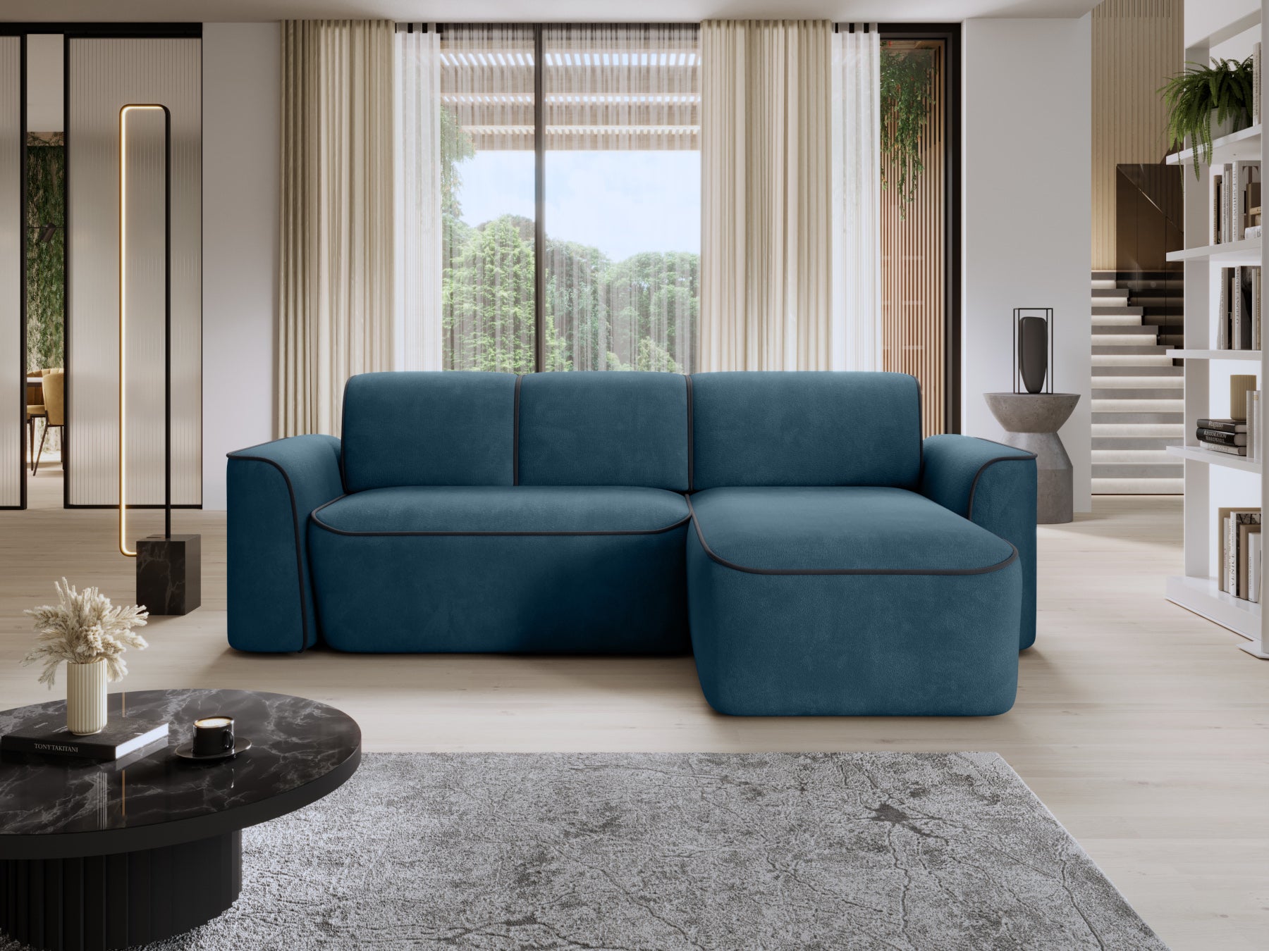 Narożnik Ume w układzie prawym w Amore 40 granatowym z lamówką Velvetmat 06 ciemnoszarą, ustawiony w nowoczesnym salonie przy dużym oknie.