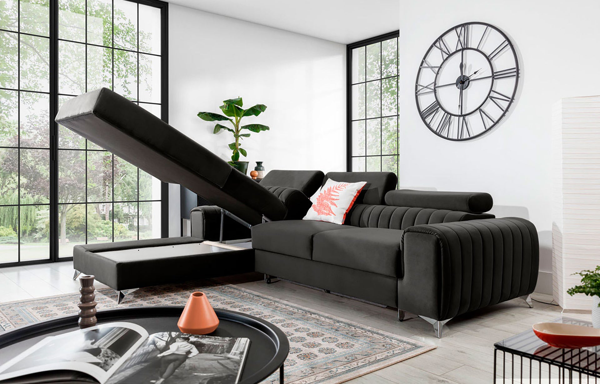 Narożnik Grayson Nube 05 ciemnoszary z otwartym pojemnikiem na pościel – funkcjonalny szezlong w układzie lewym.