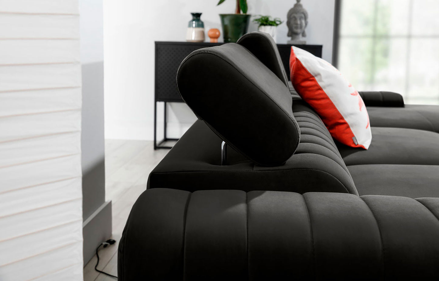 Regulowany zagłówek narożnika Grayson w kolorze Nube 05 ciemnoszary – detal pokazujący wygodne oparcie i wysoką jakość wykonania.