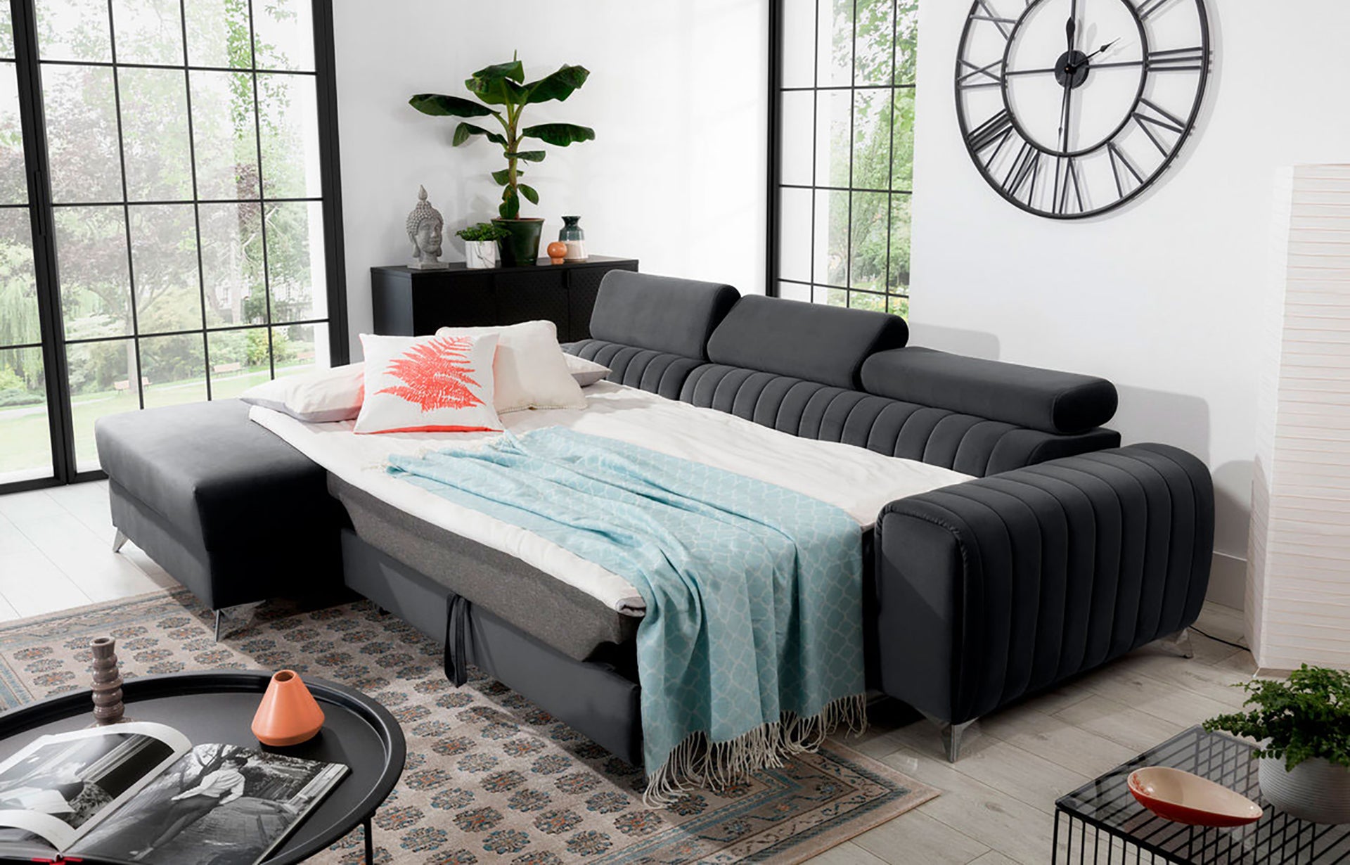 Narożnik Grayson Nube 06 ciemnoszary rozłożony do funkcji spania – komfortowe łóżko w eleganckiej aranżacji wnętrza.