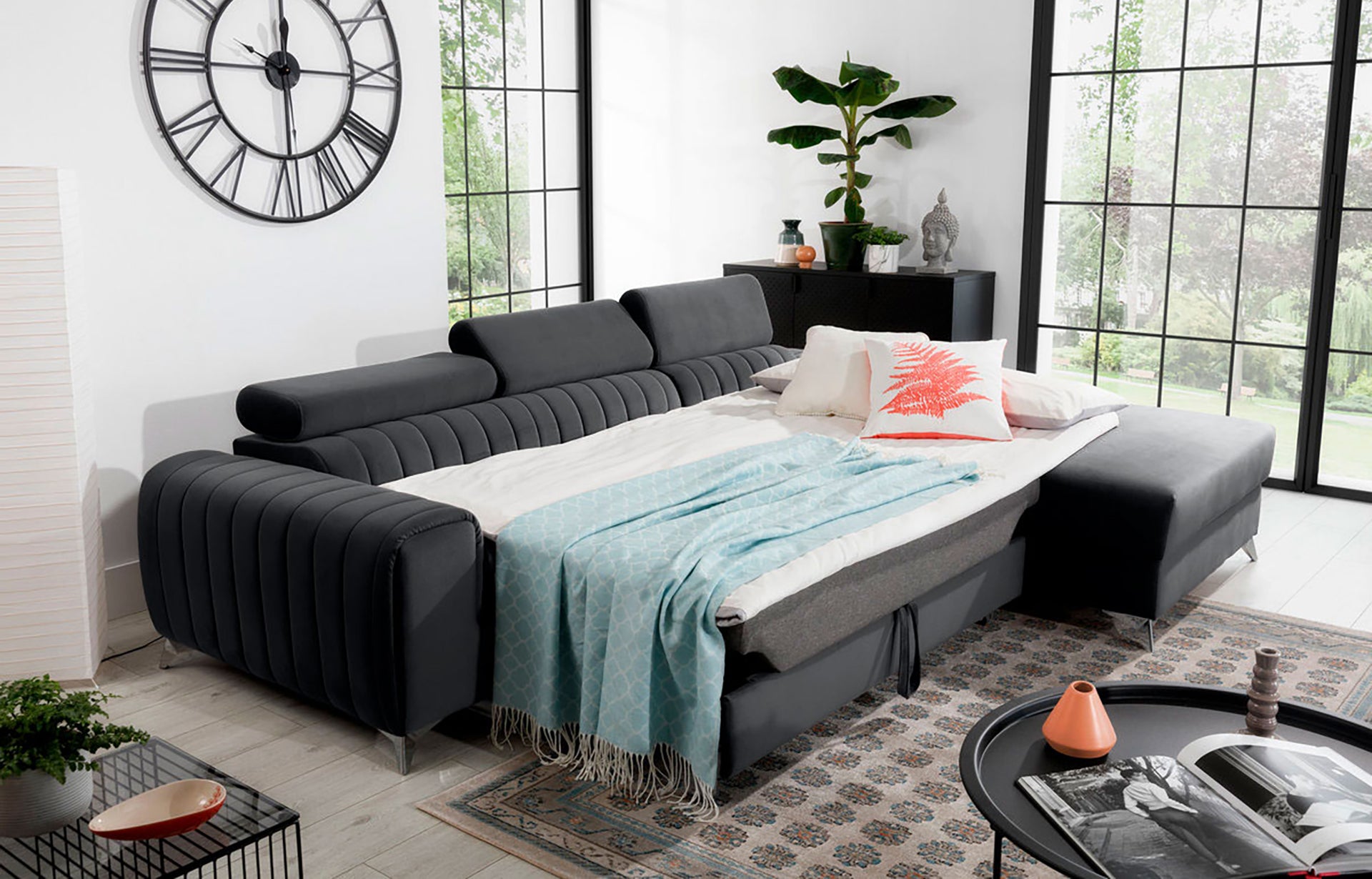 Narożnik Grayson Nube 06 ciemnoszary rozłożony do funkcji spania – komfortowa powierzchnia do snu w stylowej aranżacji wnętrza.