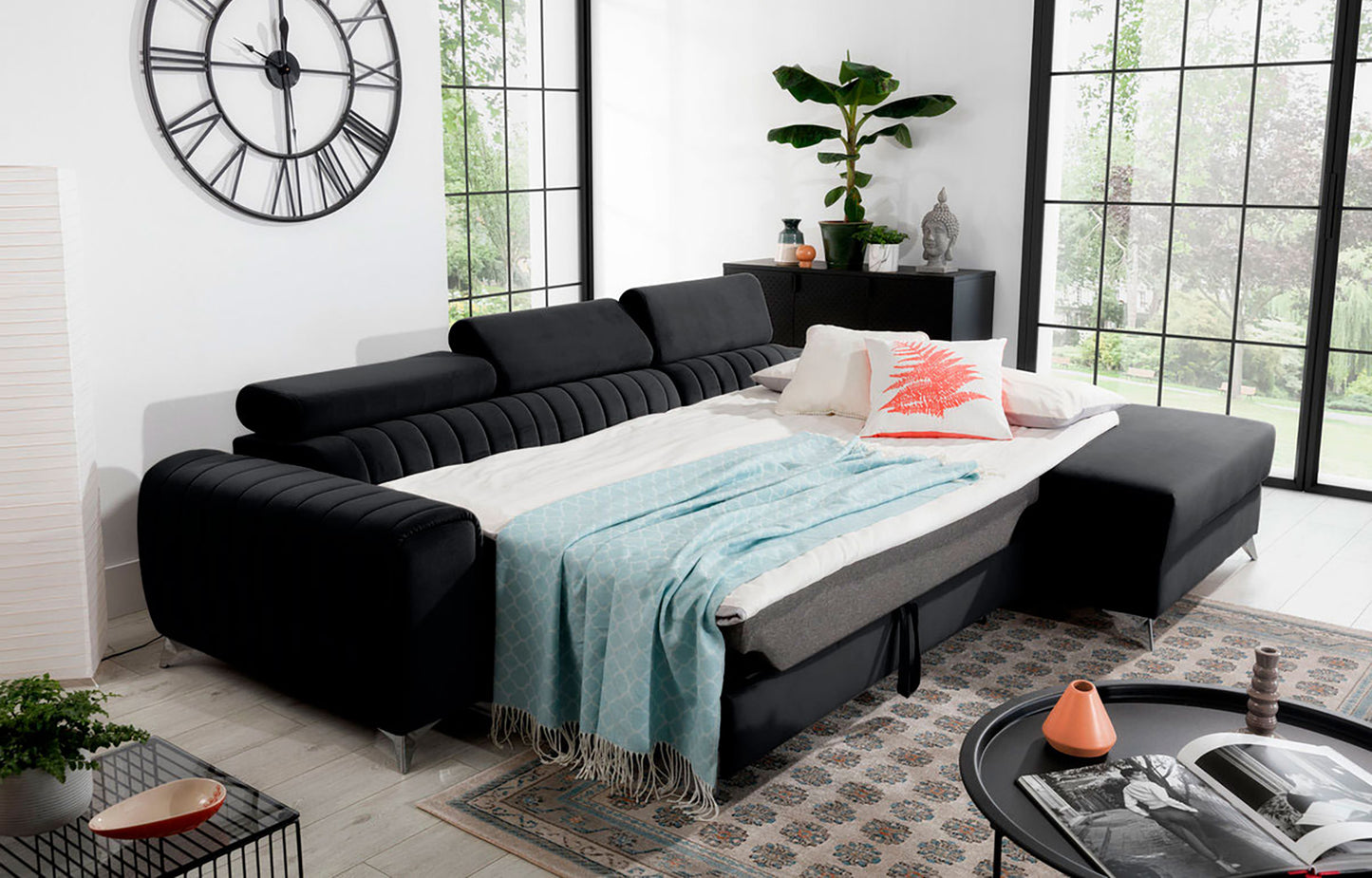 Narożnik Grayson Riviera 97 ciemnoszary rozłożony do funkcji spania – komfortowa powierzchnia do snu w eleganckiej aranżacji wnętrza.