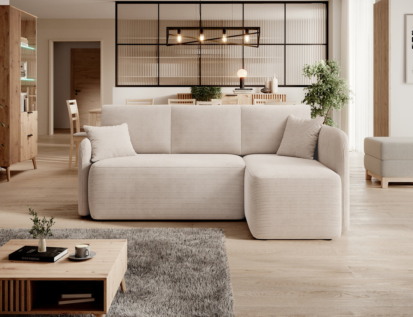 Sztruksowa sofa narożna w otwartej strefie dziennej z kuchnią i jadalnią – aranżacja nowoczesna.