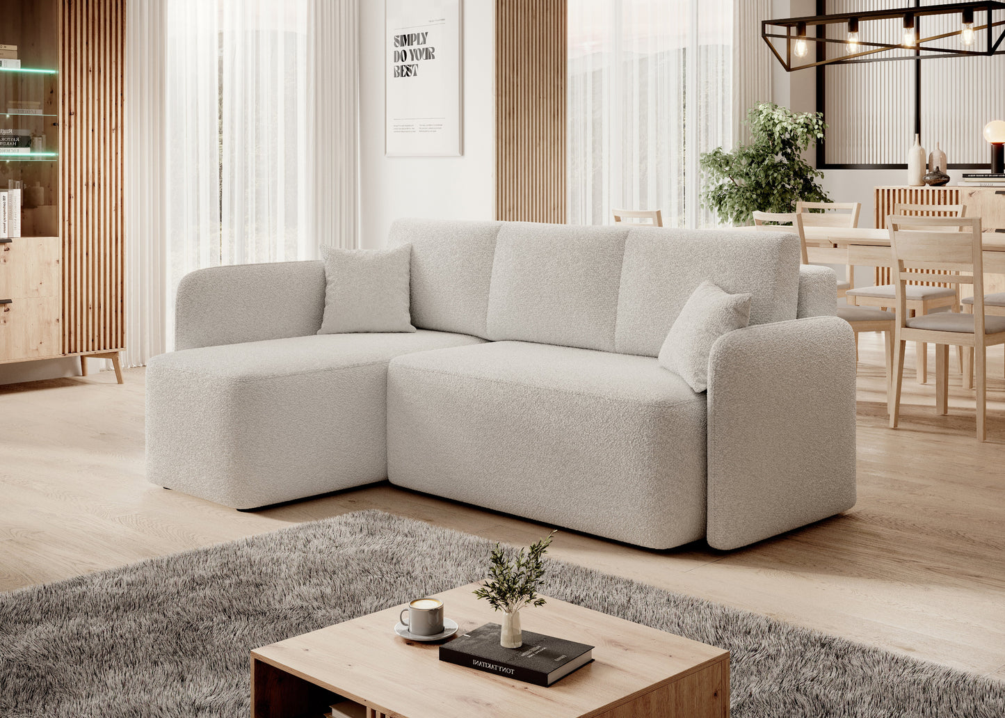 Narożnik z szezlongiem w nowoczesnym salonie z jasnymi zasłonami i stolikiem kawowym.