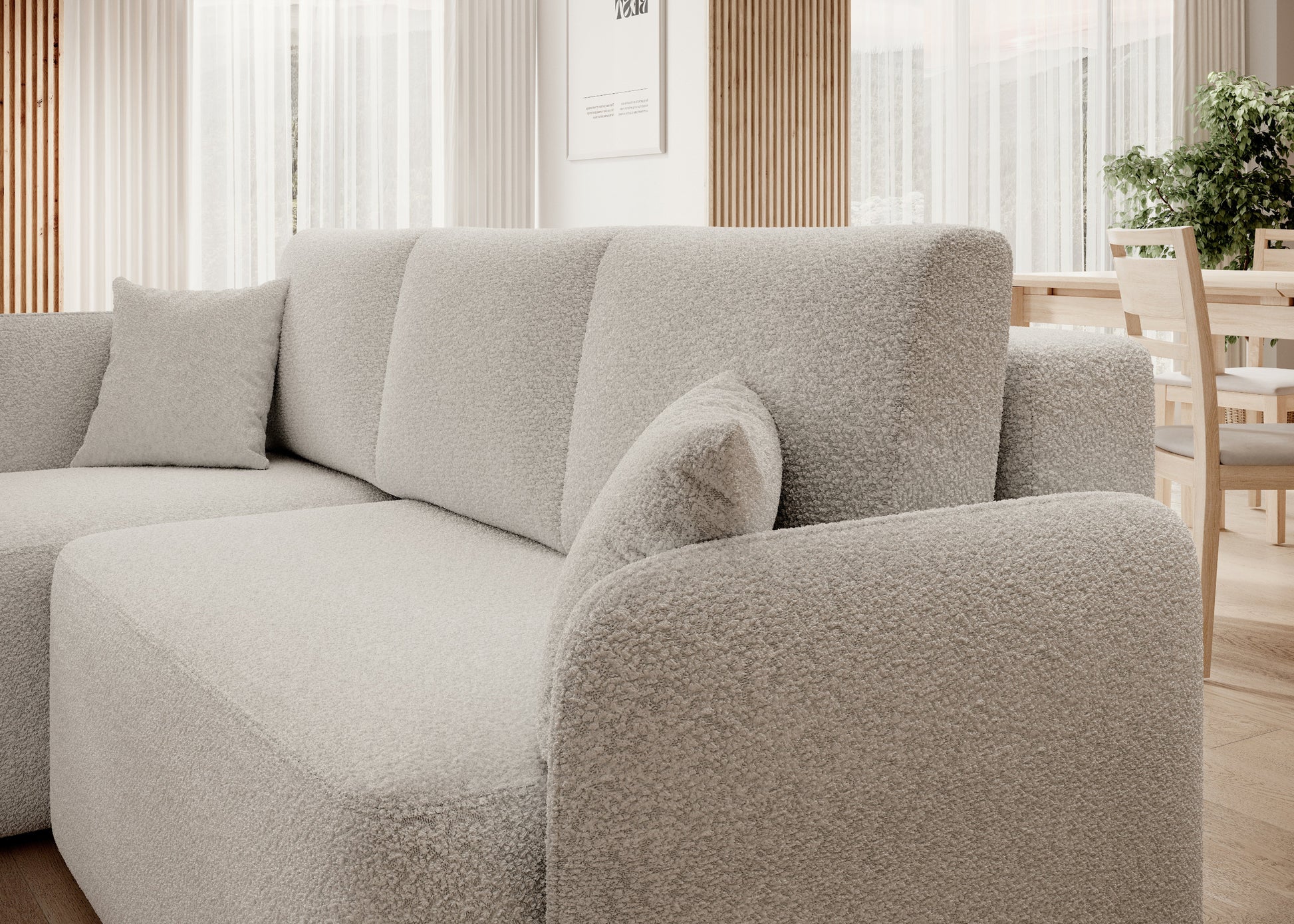 Tapicerowany narożnik z grubym oparciem i dekoracyjnymi poduszkami – komfortowe wykończenie.