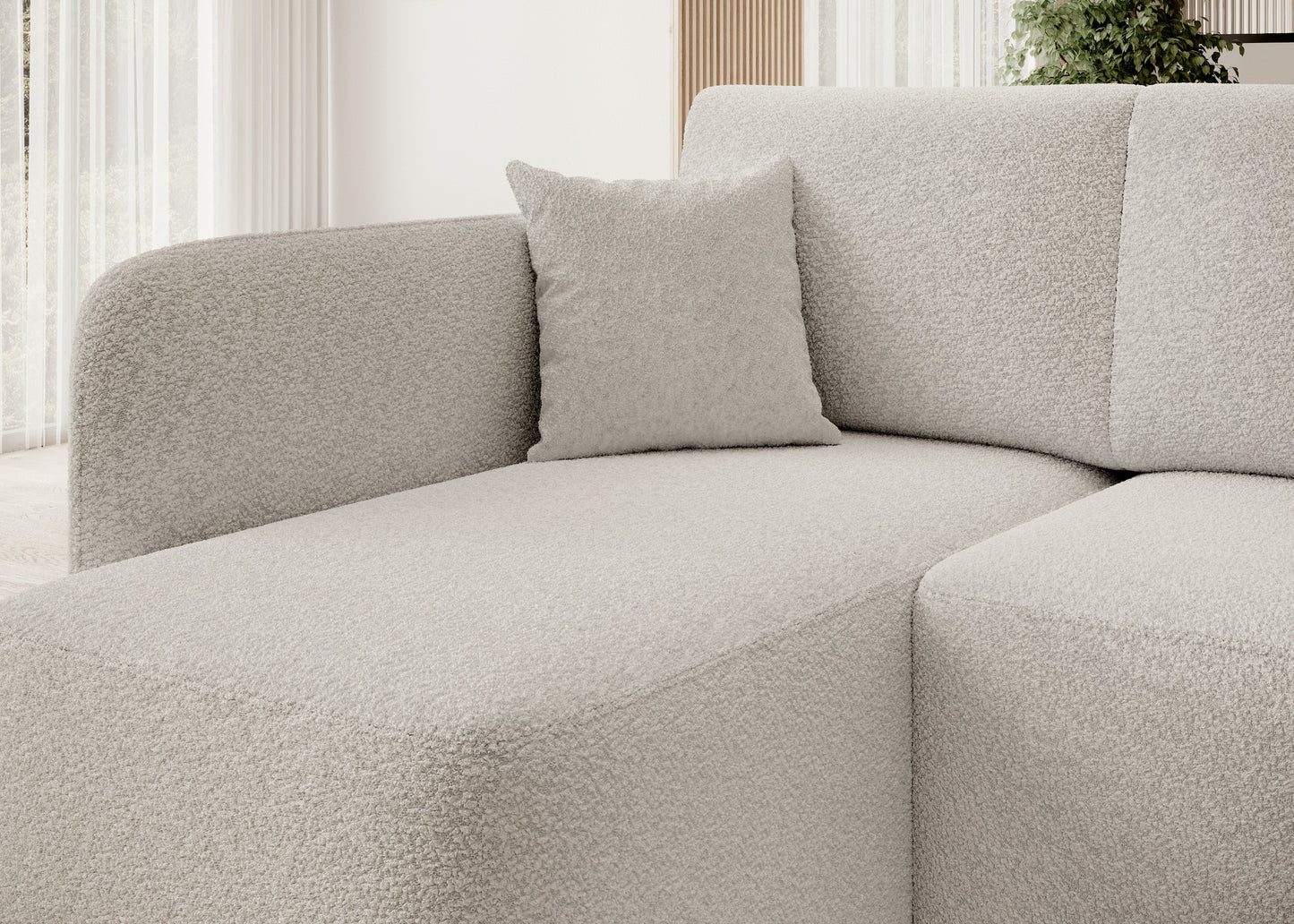 Sofa narożna z przyjemną w dotyku tkaniną boucle – idealna do wnętrz w stylu nowoczesnym.