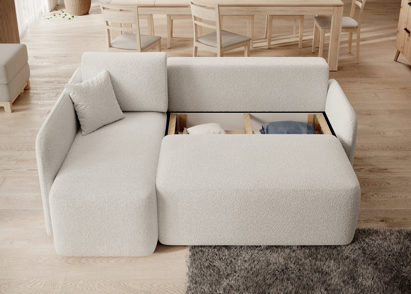 Narożnik z pojemnikiem na pościel i systemem przechowywania – praktyczne rozwiązanie do salonu.