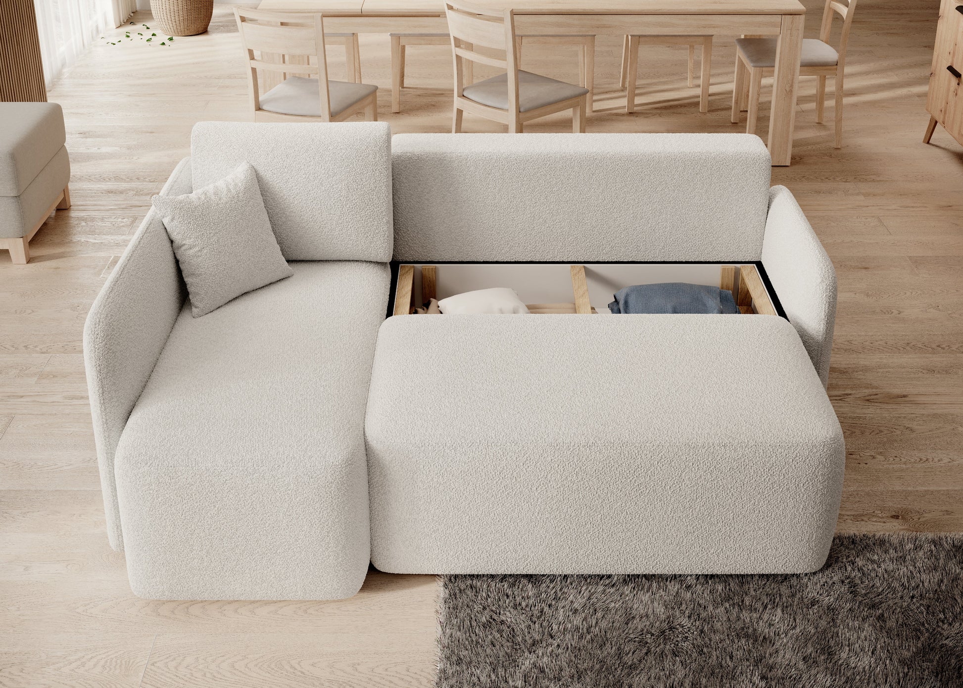 Narożnik z pojemnikiem na pościel i systemem przechowywania – praktyczne rozwiązanie do salonu.