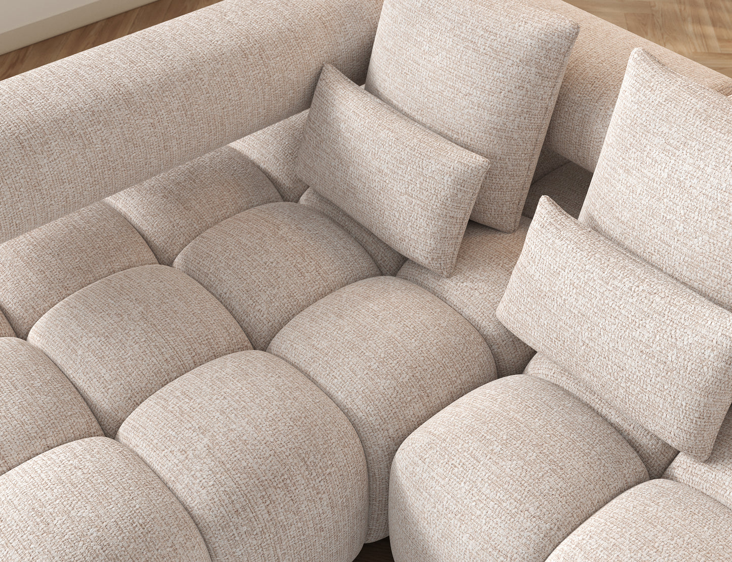 Na fotografii pokazano oparcie narożnika Levvi w tkaninie Bazalt 18 beżowy – gładka tapicerka i subtelne przeszycia podkreślają nowoczesny design oraz wygodne podparcie pleców.