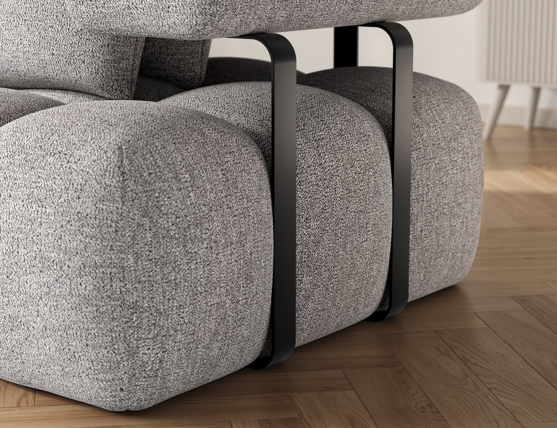 Detal narożnika Levvi lewy ELTAP w tkaninie Coralline 03 szaro-czarny boucle – solidne czarne metalowe nogi przy podłokietniku
