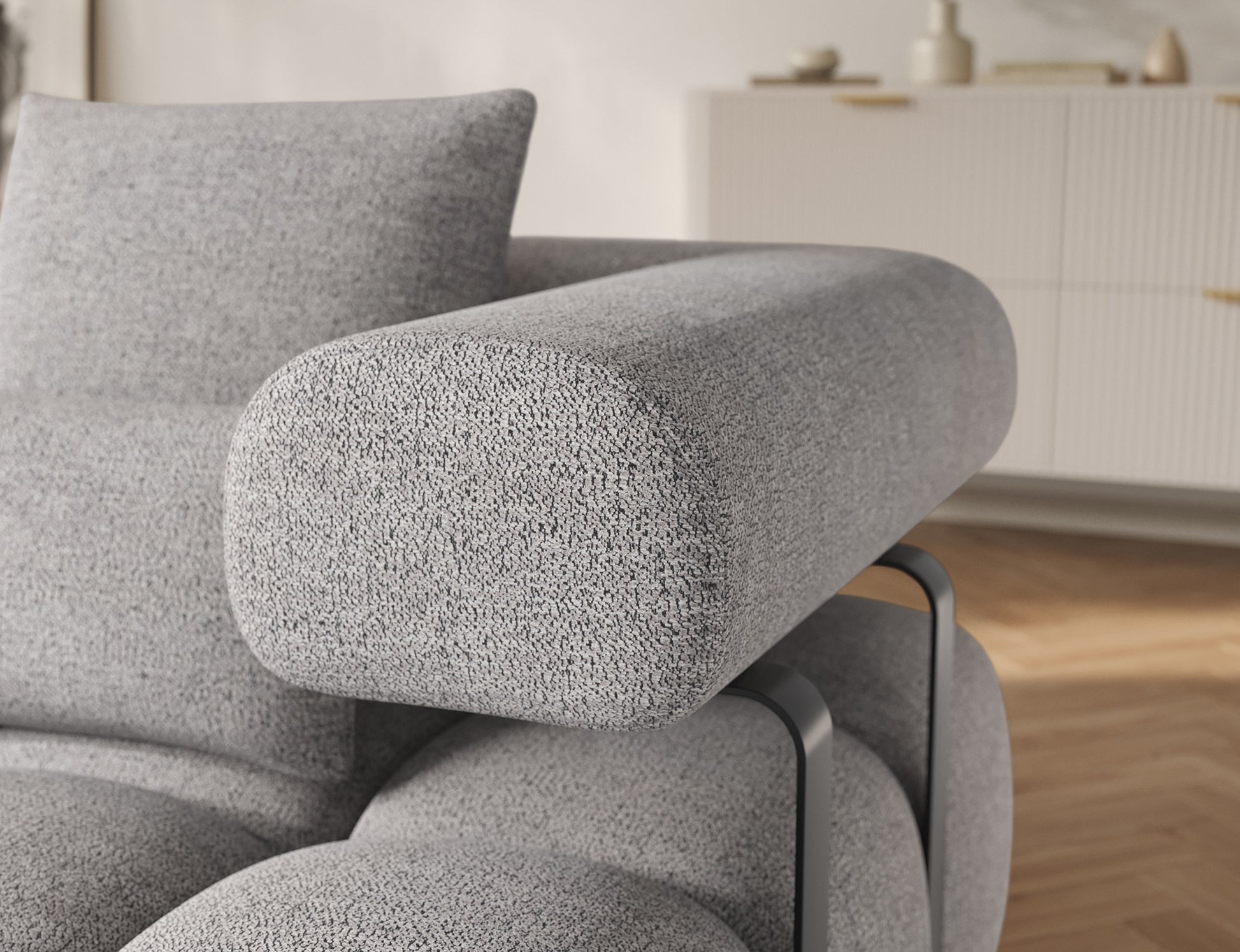Zbliżenie na podłokietnik narożnika Levvi lewy ELTAP w tkaninie Coralline 03 szaro-czarny boucle z eleganckim metalowym stelażem