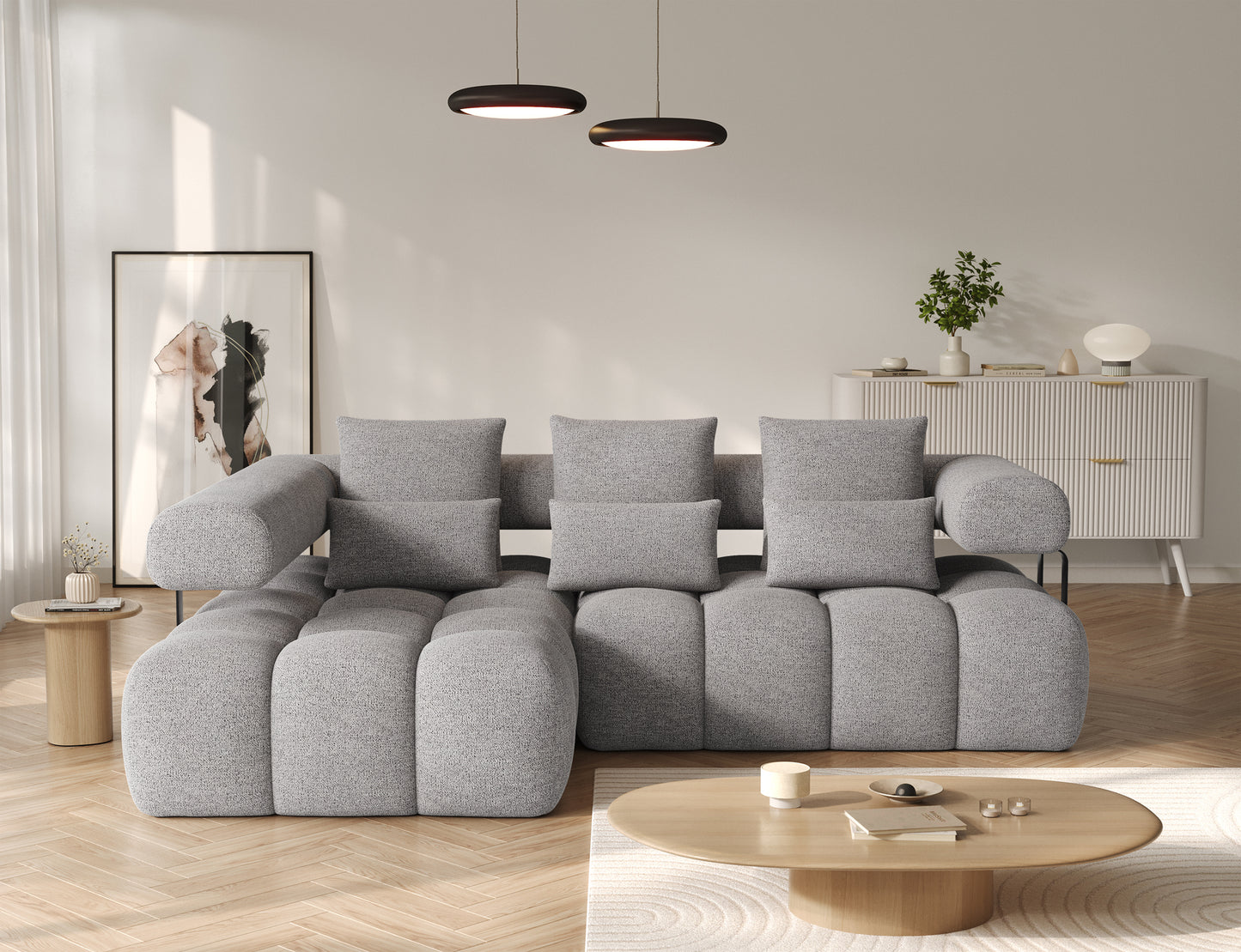 Narożnik Levvi lewy ELTAP w tkaninie Coralline 03 szaro-czarny boucle, widok od frontu z kompletem poduszek dekoracyjnych