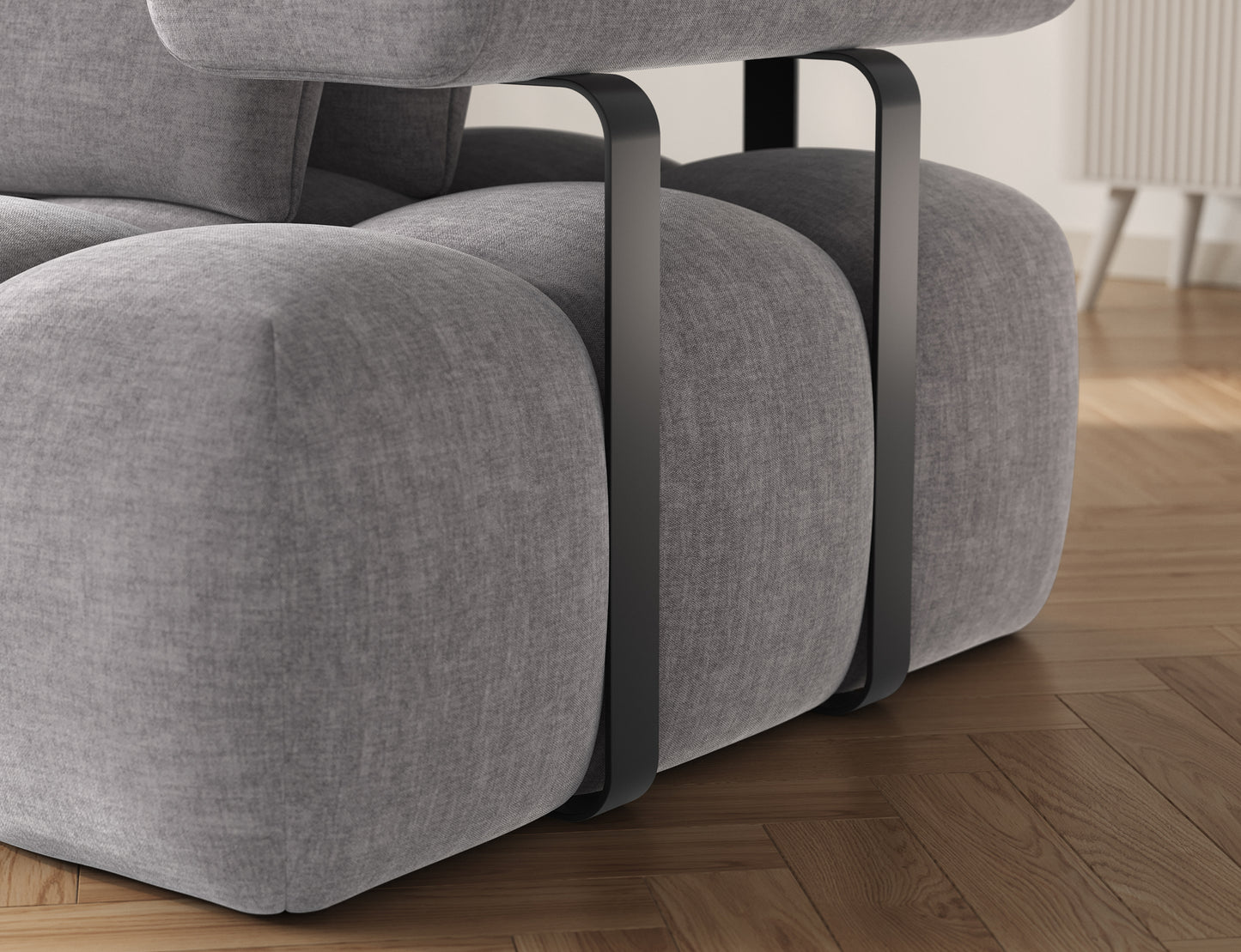 Detal narożnika Levvi ELTAP – welur easy clean jasnoszary, zbliżenie na metalowe czarne nogi i wykończenie tapicerki