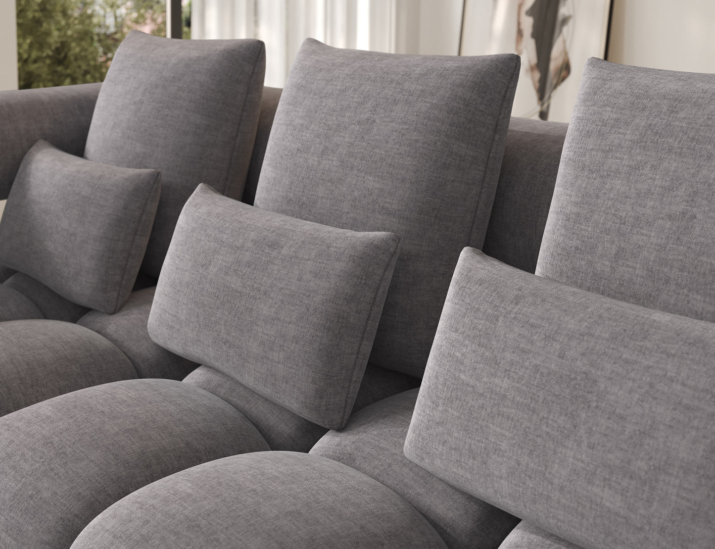 Zbliżenie na oparcia i poduszki narożnika Levvi ELTAP w jasnoszarym welurze easy clean, wygodne wykończenie i miękkie siedzisko