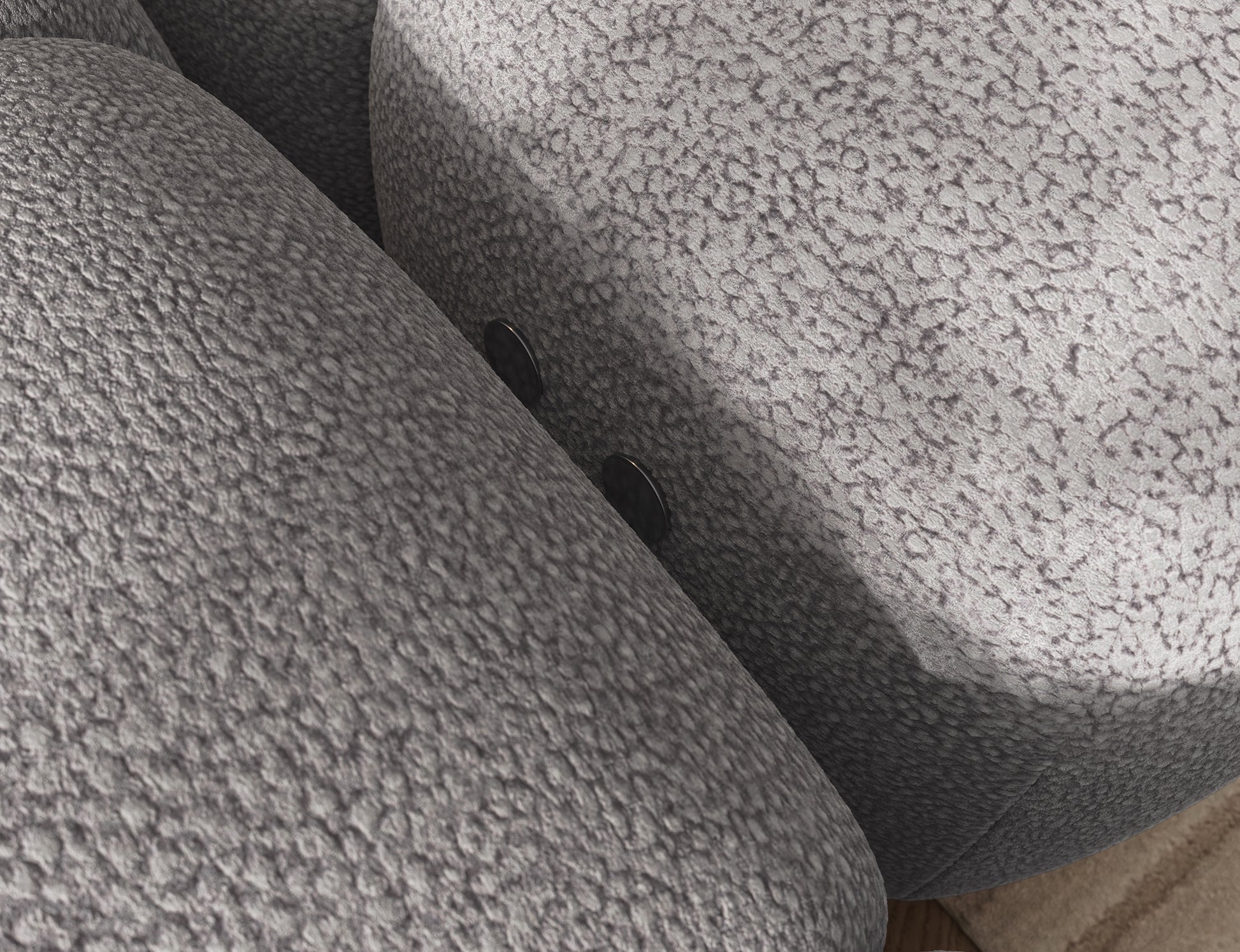 Detal narożnika Levvi lewy Paolli 04 szary – zbliżenie na tkaninę o strukturze boucle podkreślającą elegancję i miękkość mebla.