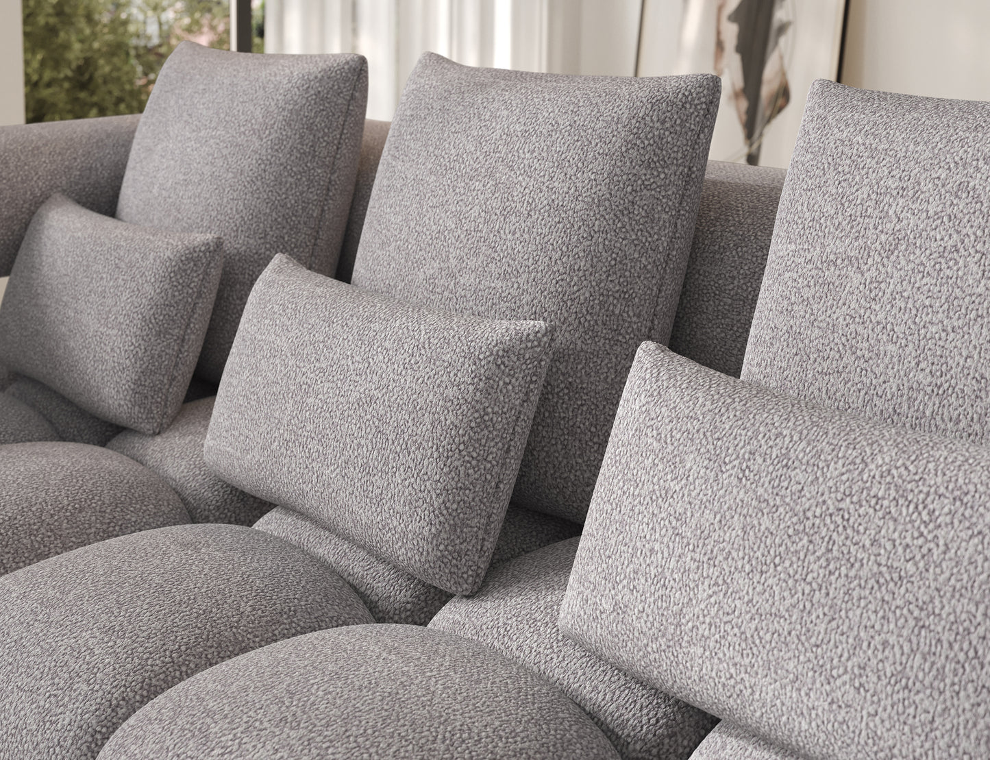 Detal poduszek narożnika Levvi lewy Paolli 04 szary – miękka, przyjemna w dotyku tkanina boucle zapewniająca wyjątkowy komfort.