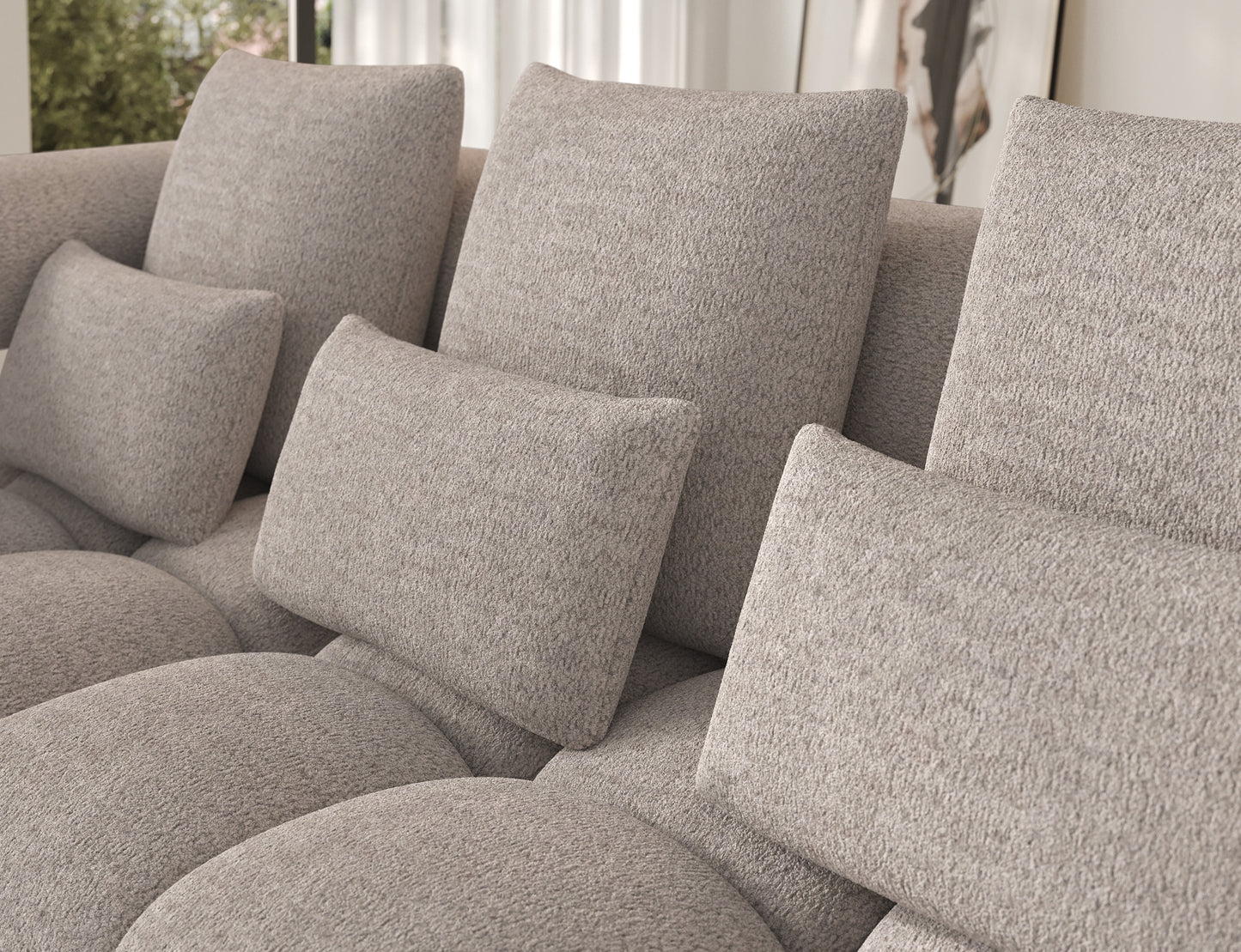 Narożnik Levvi lewy Royal 18 jasnobeżowy miękka boucle, detal miękkich poduszek oparciowych podkreślających komfort wypoczynku.