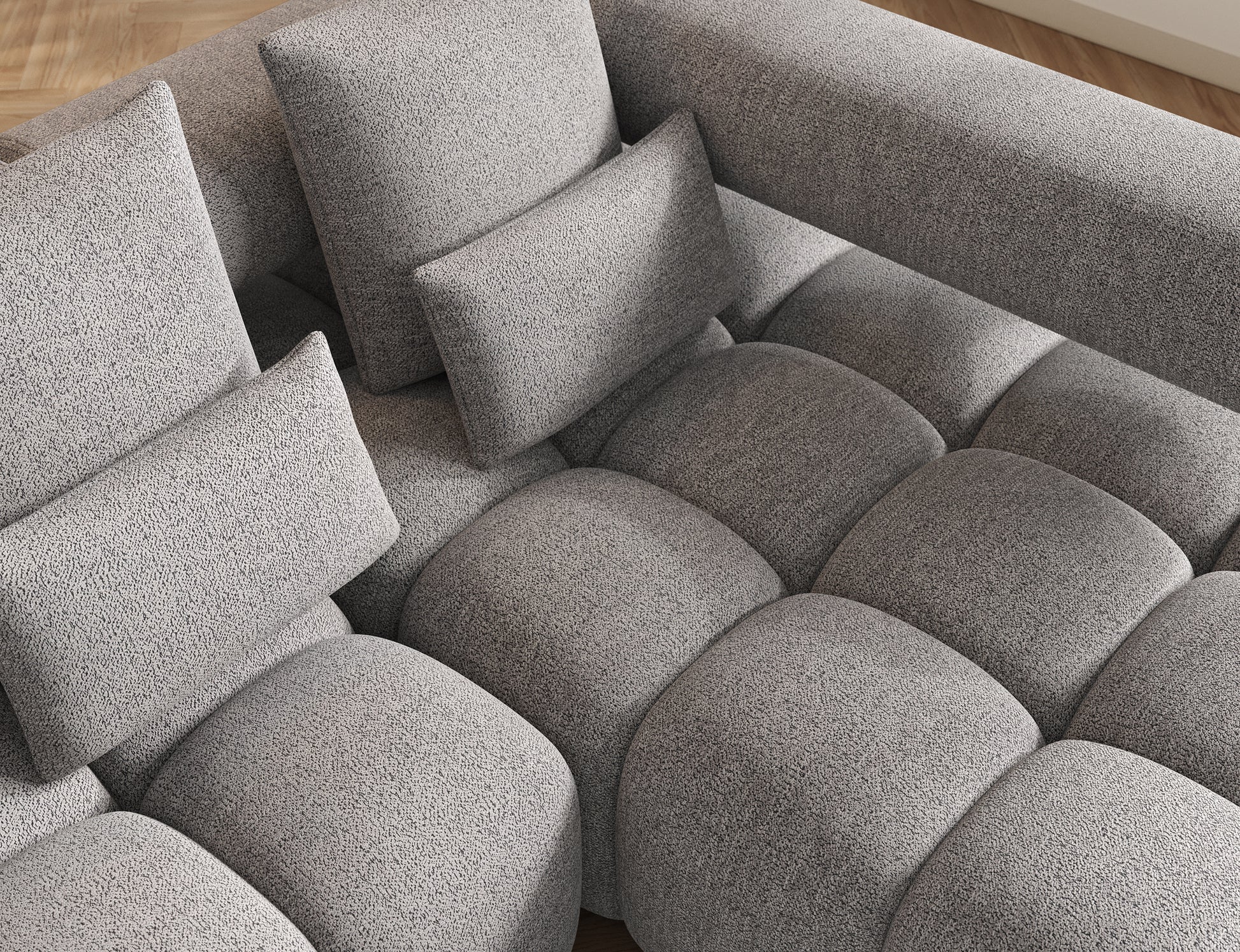 Widok z góry na siedzisko narożnika Levvi prawy ELTAP w tkaninie boucle Coralline 03 szaro-czarnej, miękkie poduchy.