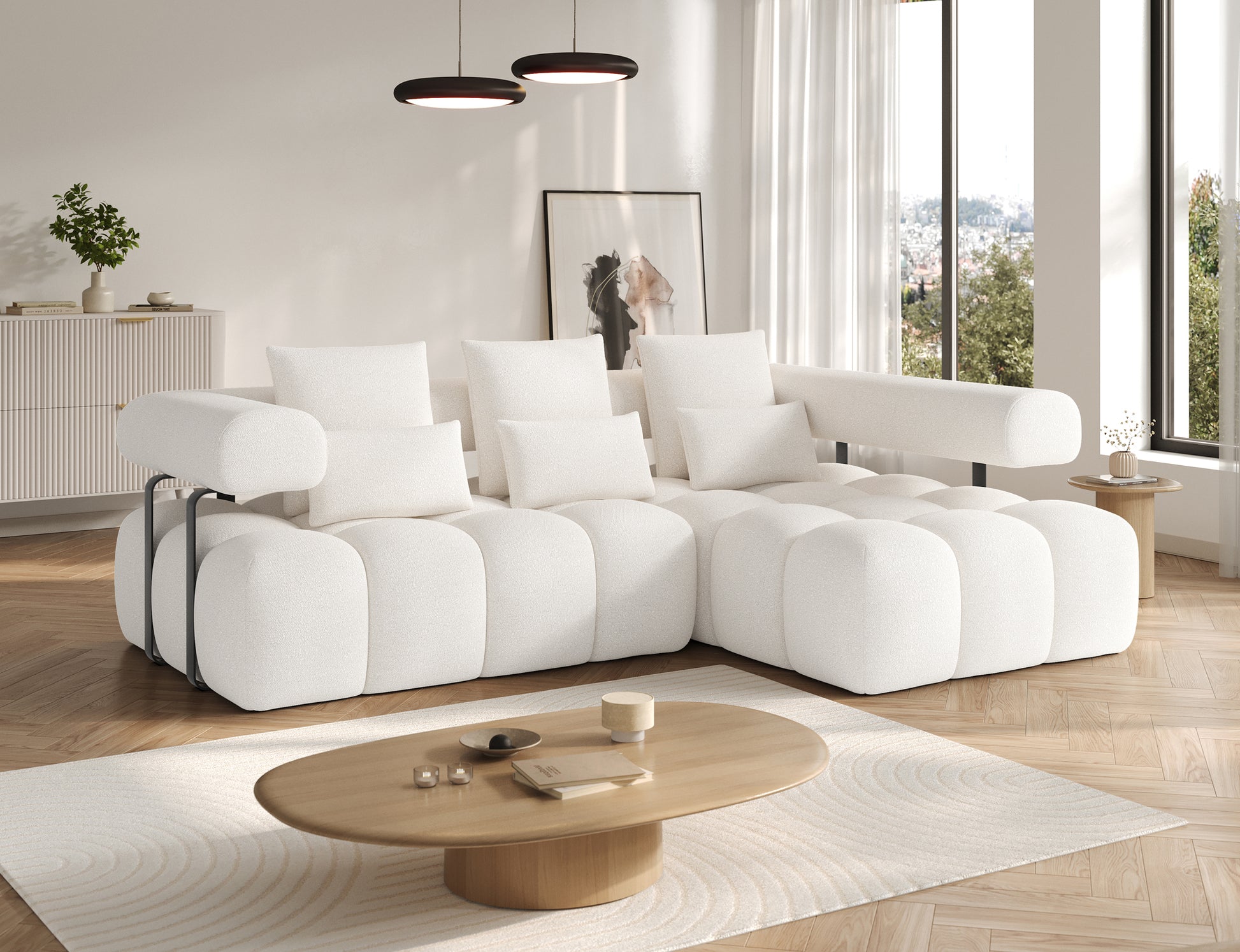 Widok narożnika Levvi prawy Jaffray 01 z boku – miękka forma, biała tkanina boucle i nowoczesne, metalowe detale.