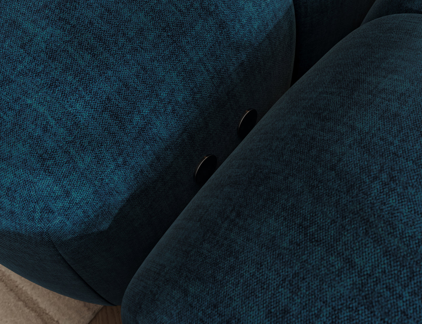 Detal narożnika Levvi w tkaninie Manhattan 40, granatowa struktura materiału, solidne łączenie elementów i miękkie wykończenie.