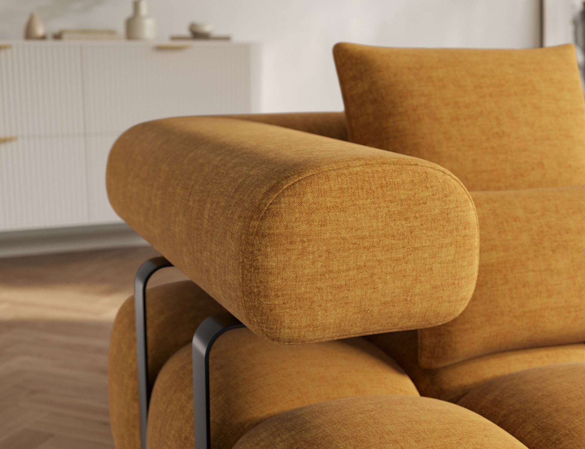 Zbliżenie na podłokietnik narożnika Levvi prawy Manhattan 45 żółty, podkreślające miękkie linie i stabilną, metalową konstrukcję.