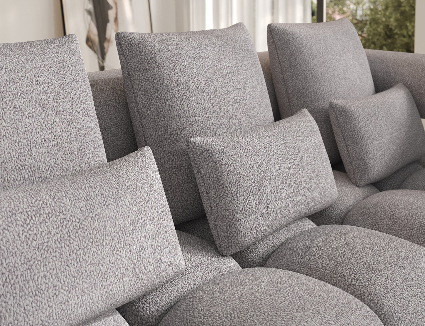 Zbliżenie na poduszki narożnika Levvi Paolli 04 szary – miękkie oparcia gwarantują wyjątkową wygodę wypoczynku.