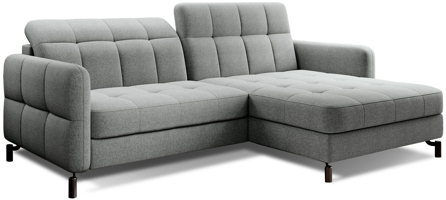 Szary narożnik Lorelle Inari 91 w układzie prawym na białym tle, z pikowanymi poduszkami oparcia i prostymi podłokietnikami.