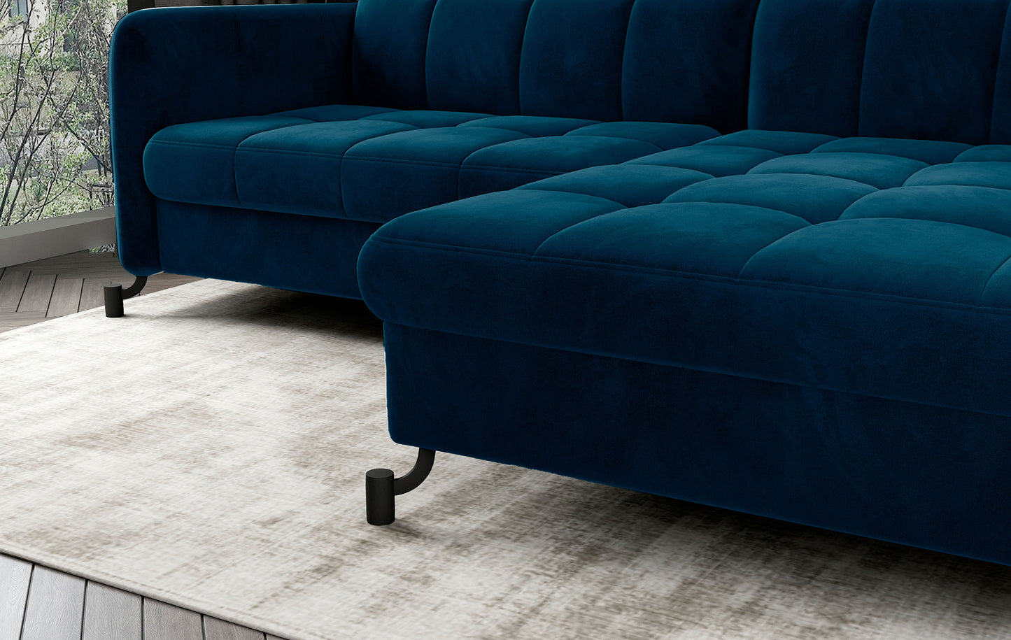 Zbliżenie na siedzisko narożnika Lorelle Monolith 77 niebieski z widoczną miękką tapicerką i pikowaniami.