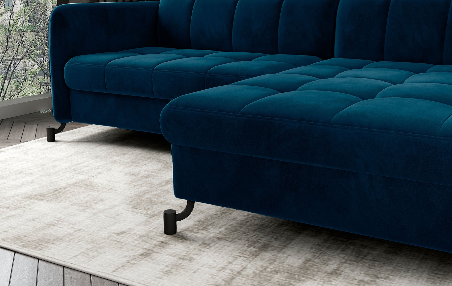 Zbliżenie na siedzisko narożnika Lorelle Monolith 77 niebieski z widoczną miękką tapicerką i pikowaniami.