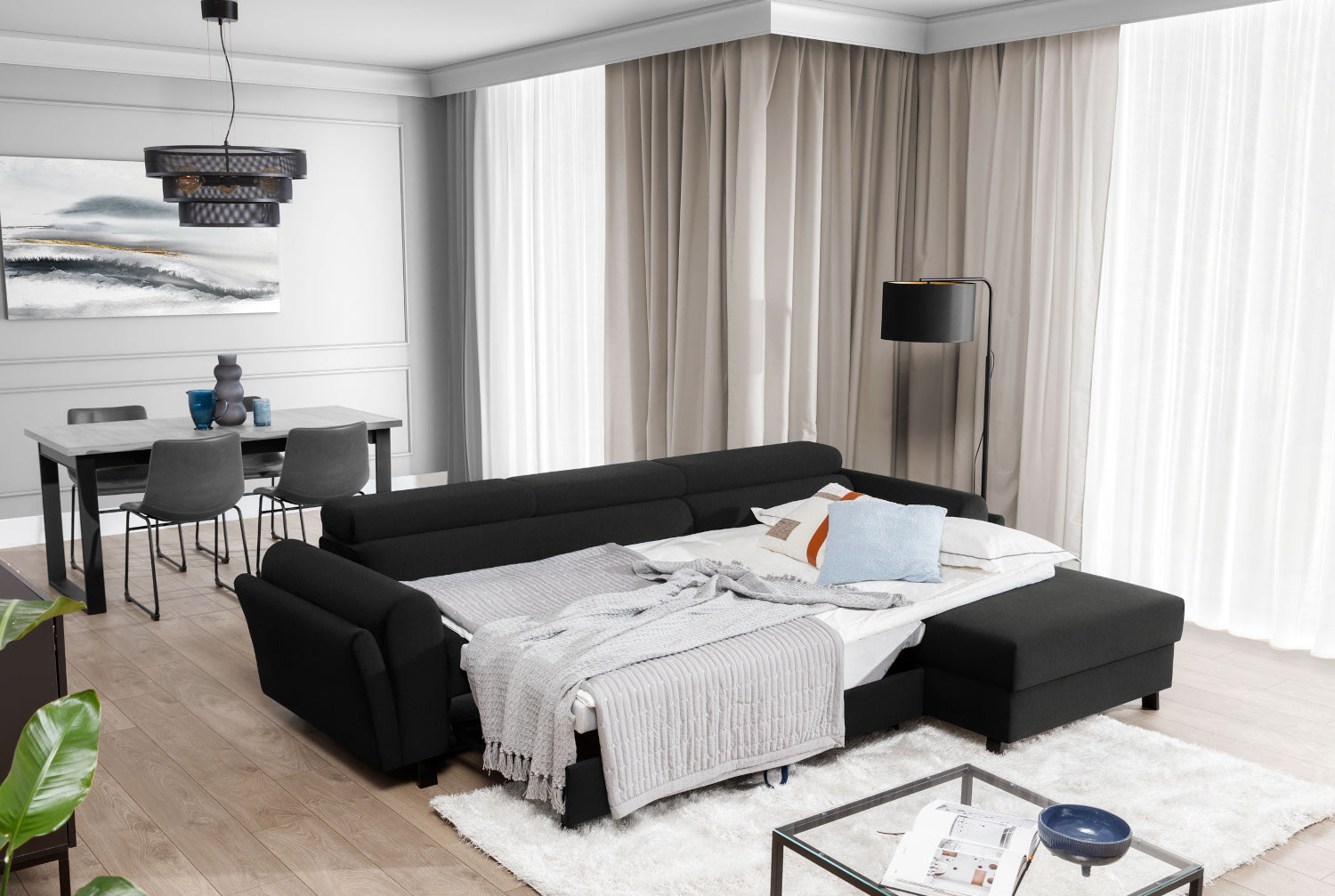 Czarny narożnik Mariall Sawana 14 z funkcją spania w aranżacji salonu, rozkładana sofa narożna z dużą powierzchnią do spania, idealna do codziennego relaksu, przyjmowania gości i komfortowego wypoczynku dla całej rodziny