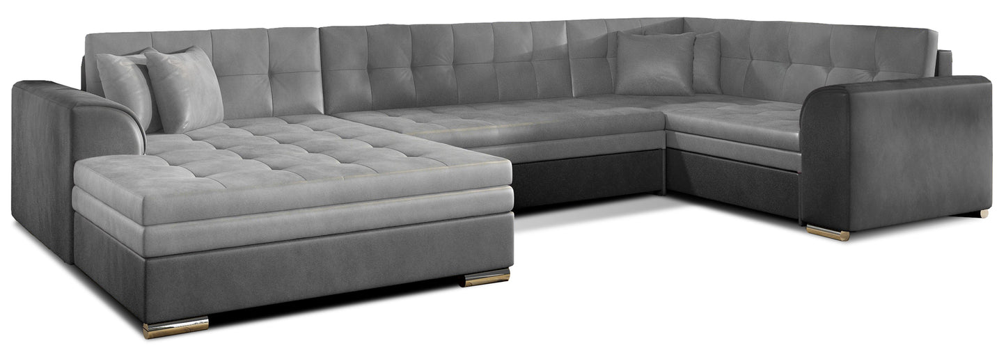 Narożnik Damario w układzie lewym, tapicerowany tkaniną Monolith 84 jasnoszary z bokami w Monolith 97 ciemnoszary, widok na całą bryłę z poduszkami.