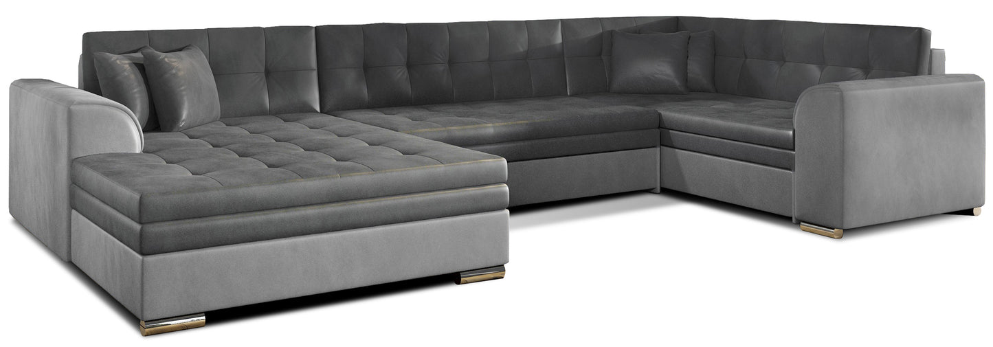 Narożnik Damario w układzie lewym, tapicerowany tkaniną Monolith 97 ciemnoszary z bokami w Monolith 84 jasnoszary, widok na całą bryłę z poduszkami.