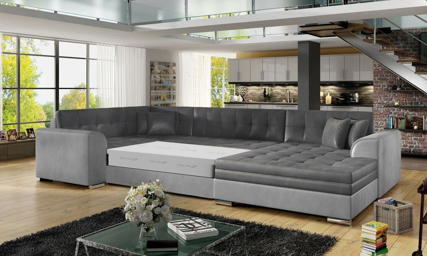 Narożnik Damario w kolorze ciemnoszarym i jasnoszarym z rozłożoną funkcją spania, prezentacja przestronnej powierzchni do wypoczynku.