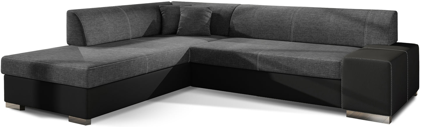 Nowoczesny narożnik Porto w zestawieniu ciemnoszarej tkaniny Sawana 05 oraz czarnej Soft 11 tworzy elegancki i wyrazisty kontrast, oferując wygodne siedziska oraz funkcjonalną przestrzeń do codziennego wypoczynku w salonie