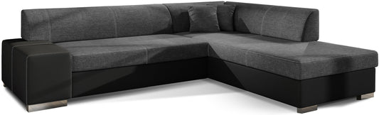 Nowoczesny narożnik Porto w połączeniu ciemnoszarej tkaniny Sawana 05 oraz czarnej Soft 11 w wersji prawostronnej tworzy wyrazisty kontrast, oferując wygodne siedziska i funkcjonalną przestrzeń do codziennego wypoczynku w salonie